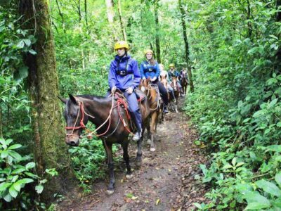 Monteverde Horseback tour guests on horses in rainforest