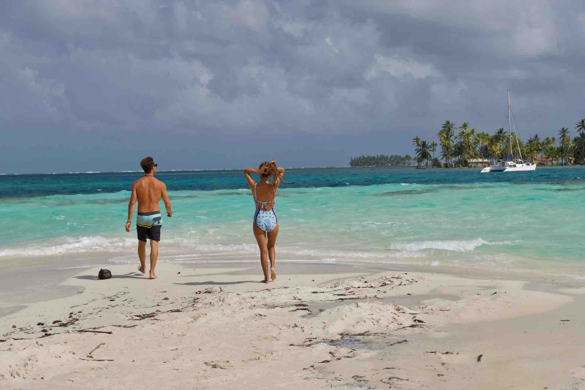 San Blas islands beach day tour couple walking into ocean