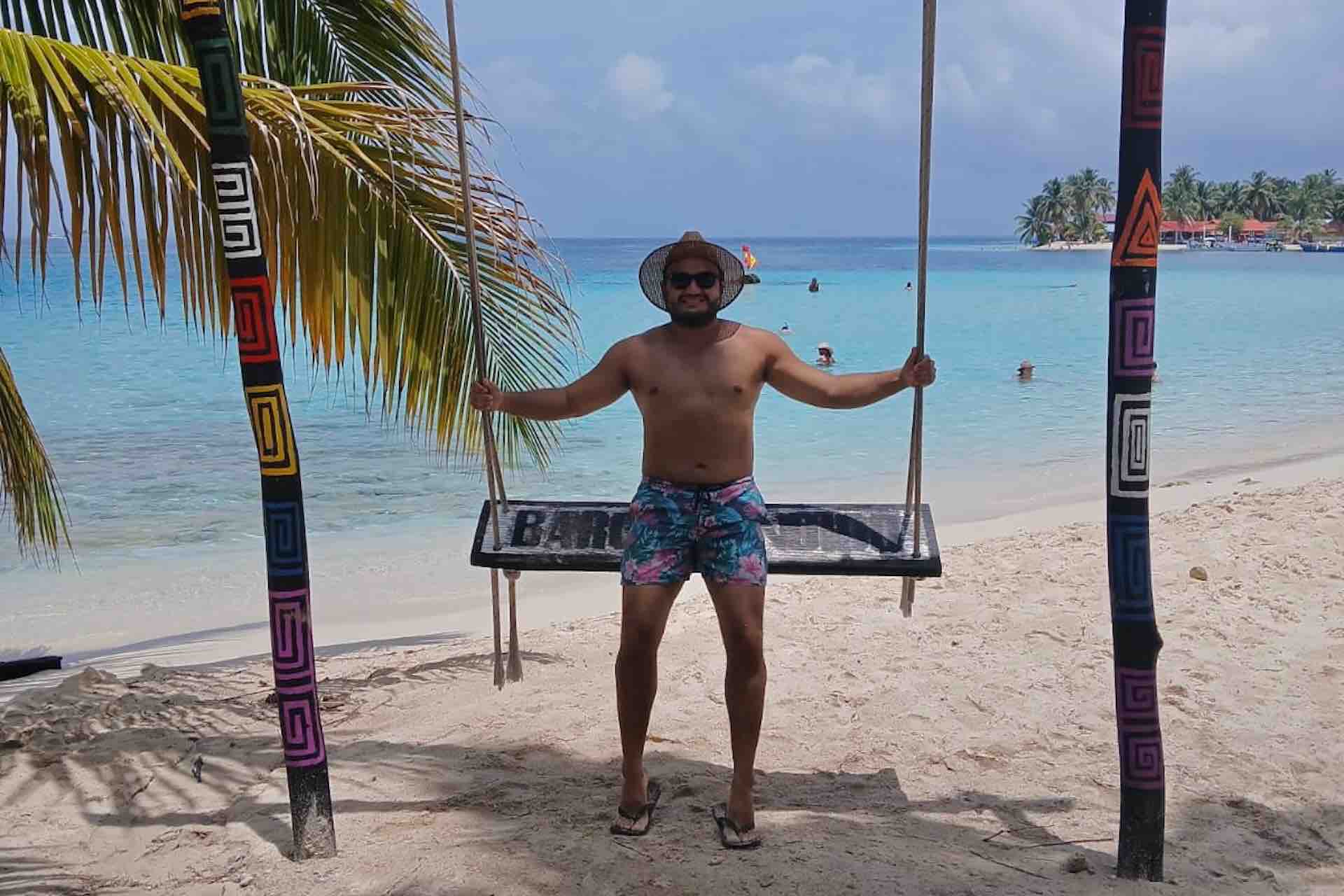 Traveler by a beach swing in the San Blas Islands