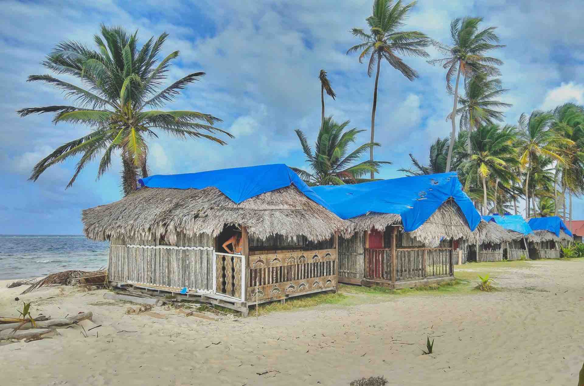 San Blas Isla Guanidup beach oceanfront cabins and palm trees