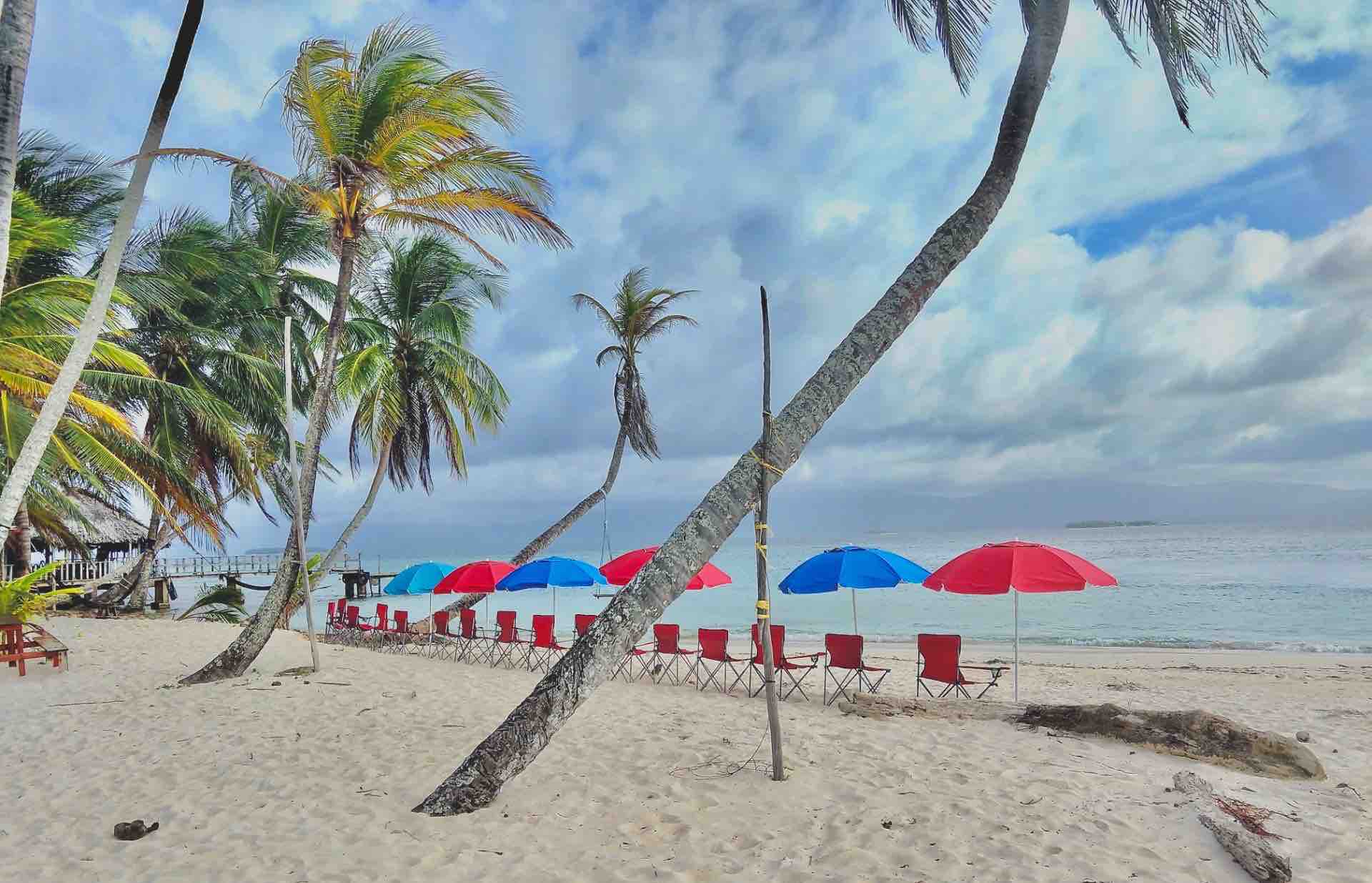 San Blas Isla Guanidup white sand beach chairs and umbrellas