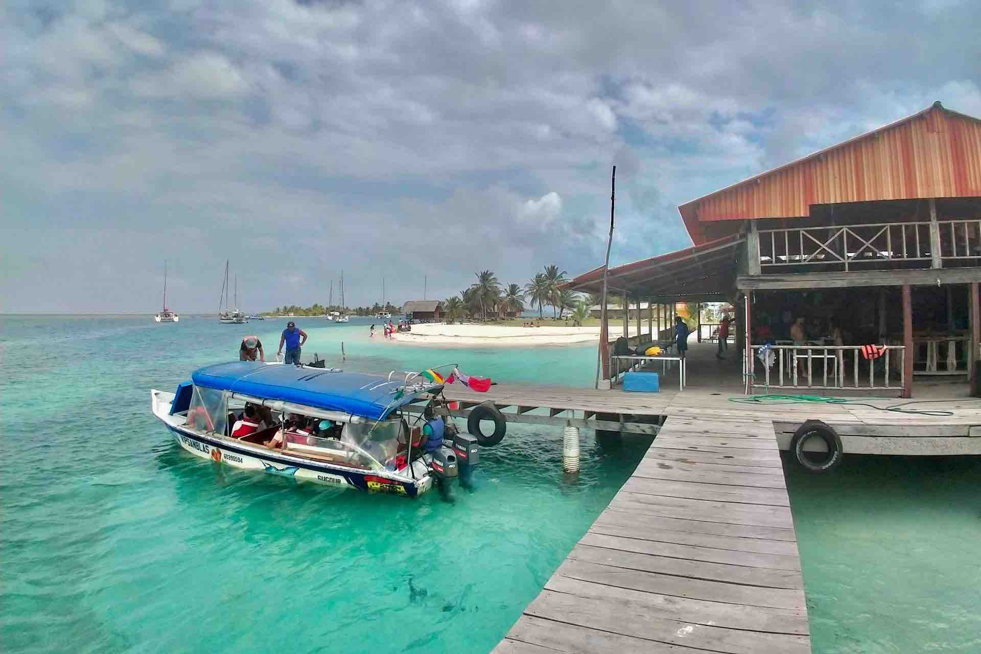 San Blas Isla Wailidup island arrival dock with boat