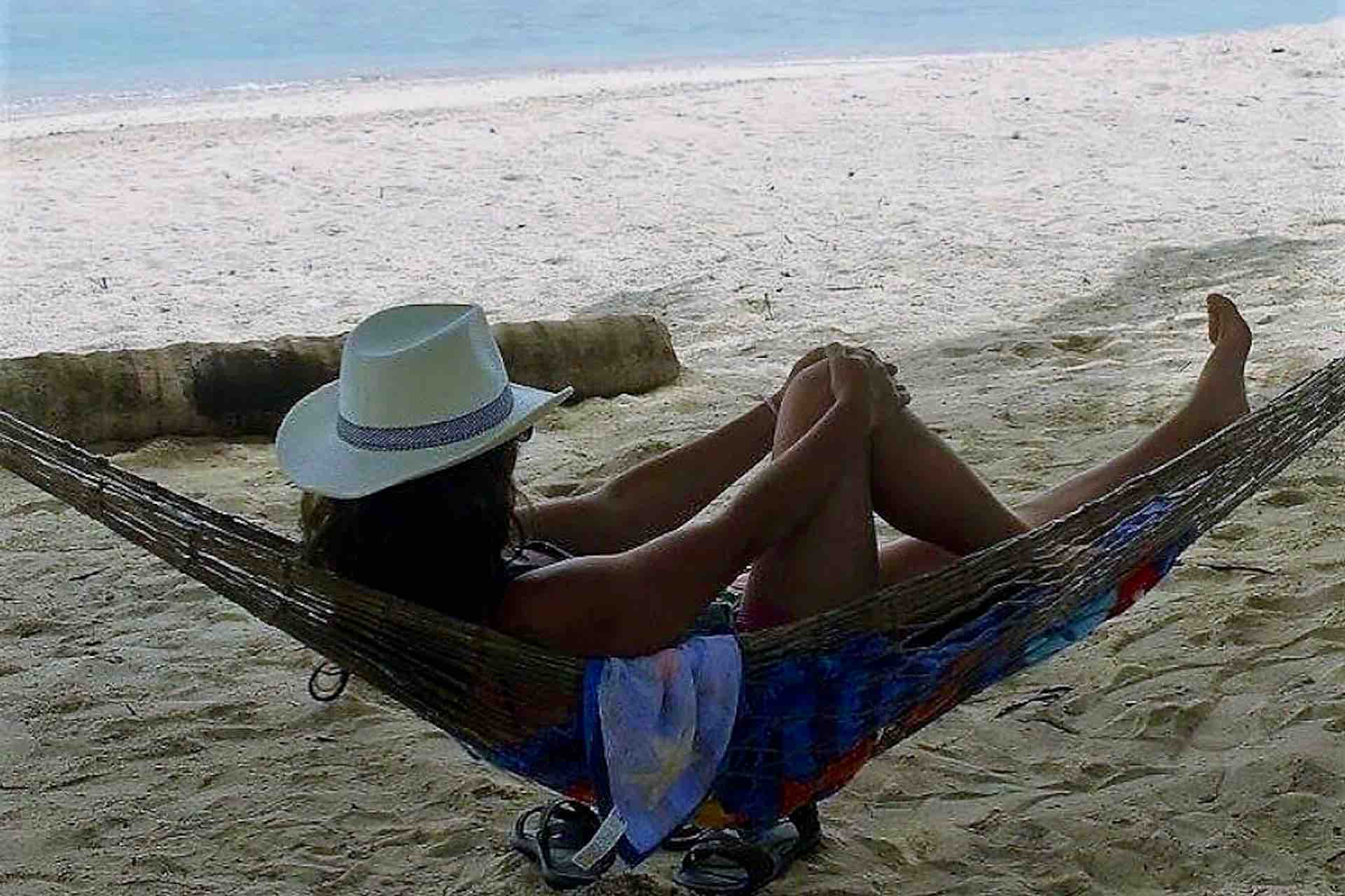 San Blas Isla Aroma iland woman in hammock ocean view