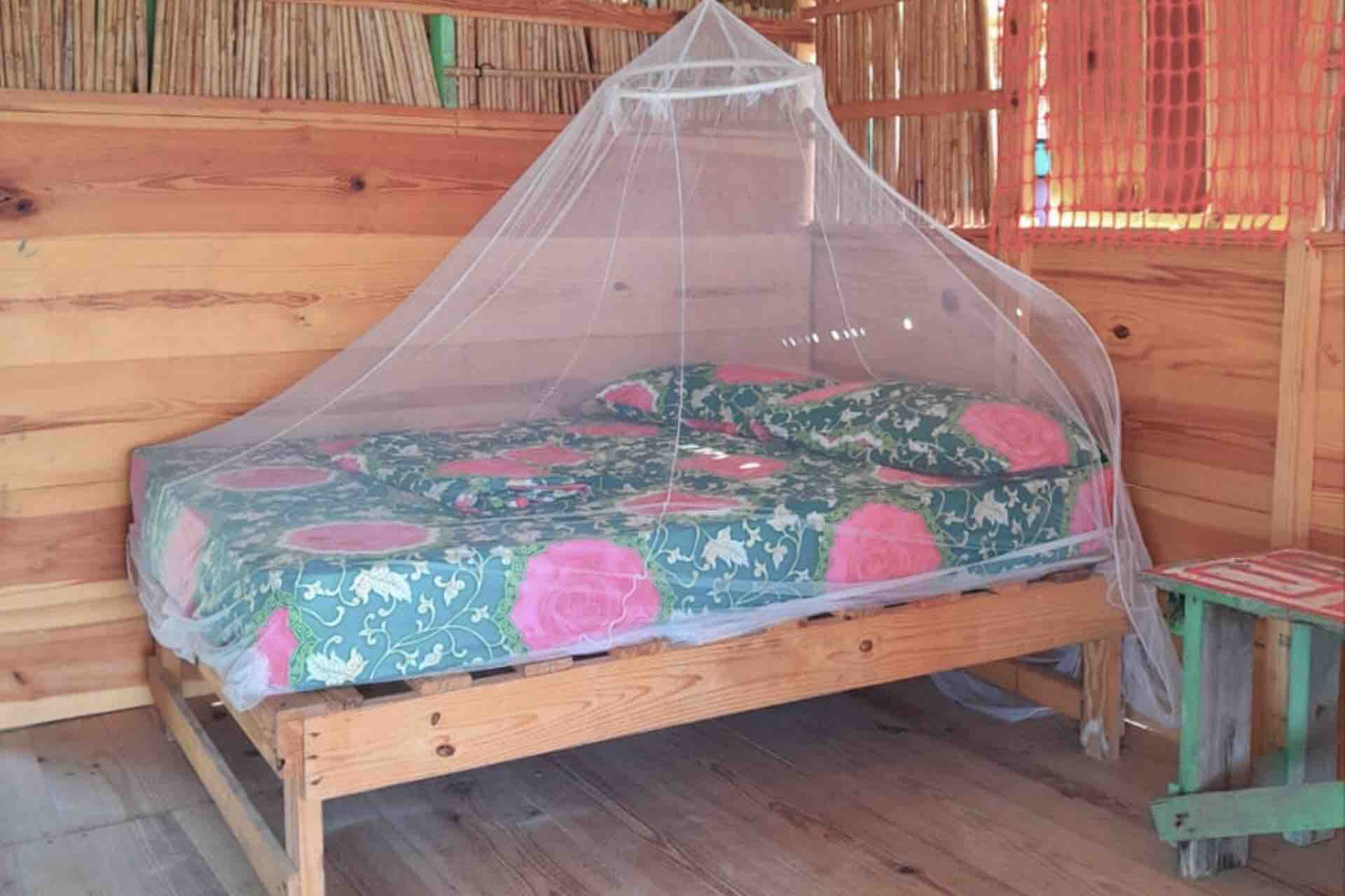 San Blas Isla Diablo island oceanfront cabin bed with mosquito net