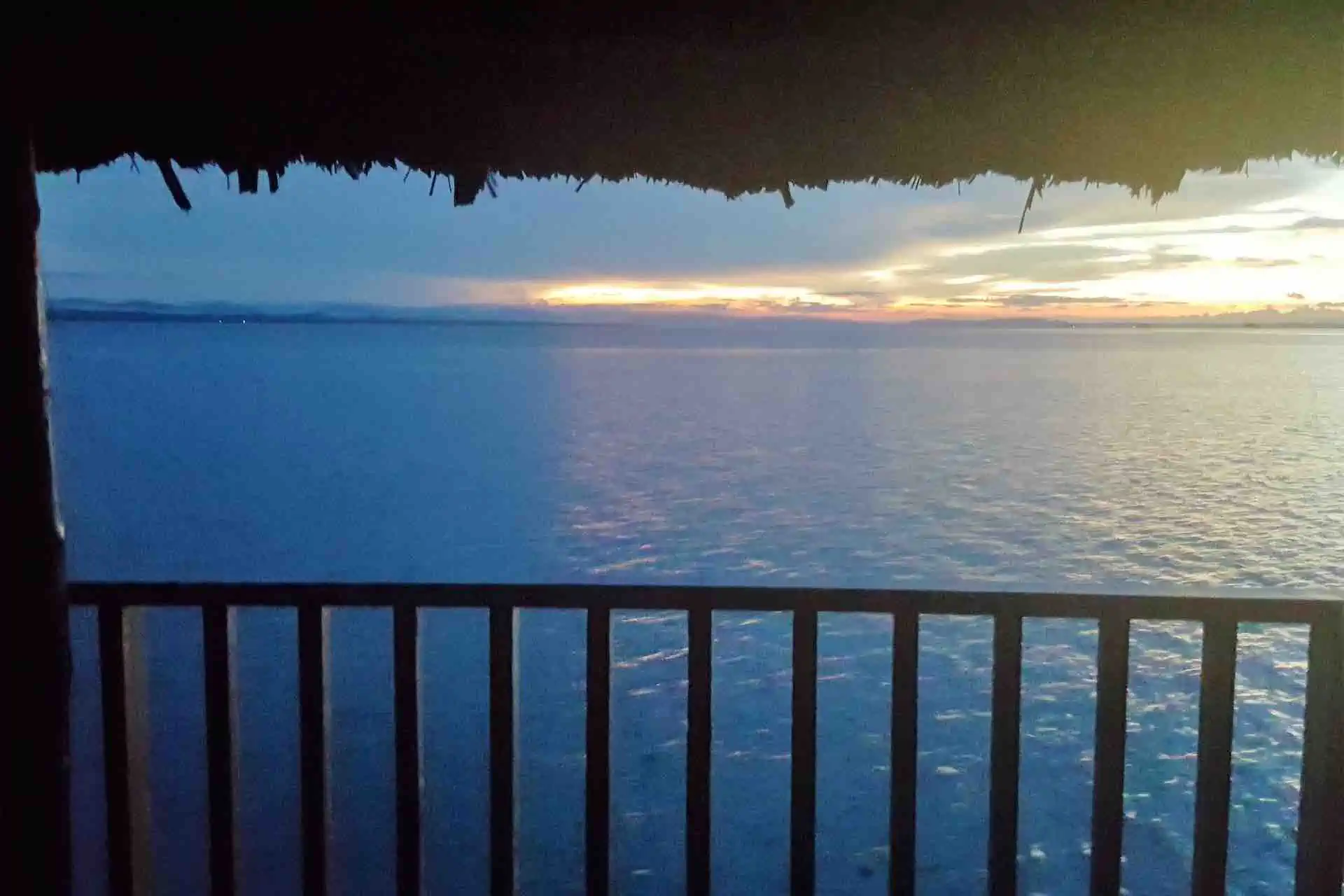 San Blas Isla Narasgandup Over Water cabins sunset view from patio