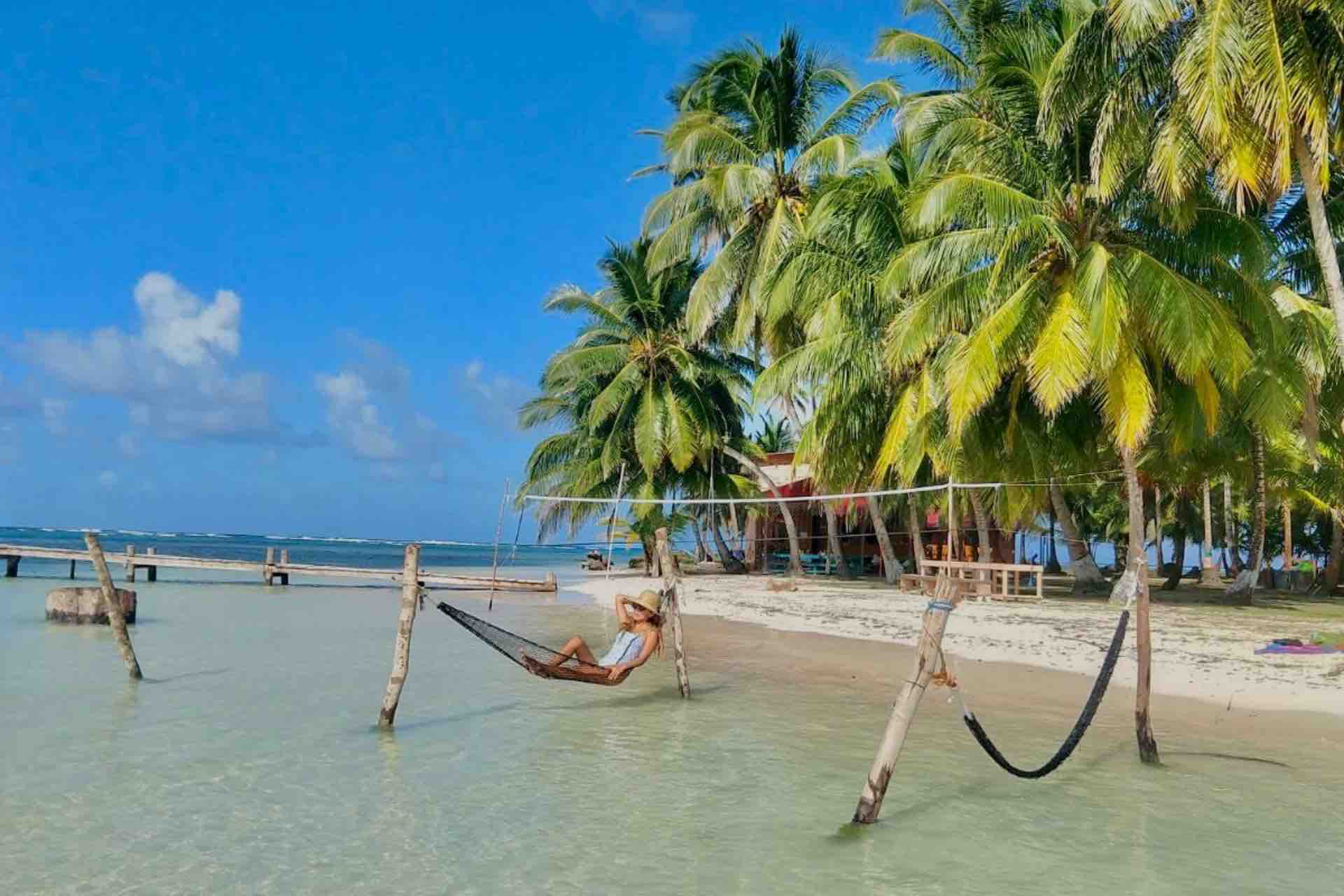 San Blas Isla Yansailadup island woman in ocean hammock