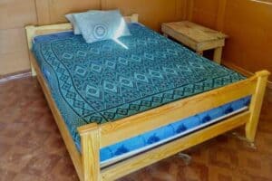 Bed in a private room on Isla Yansailadup, San Blas