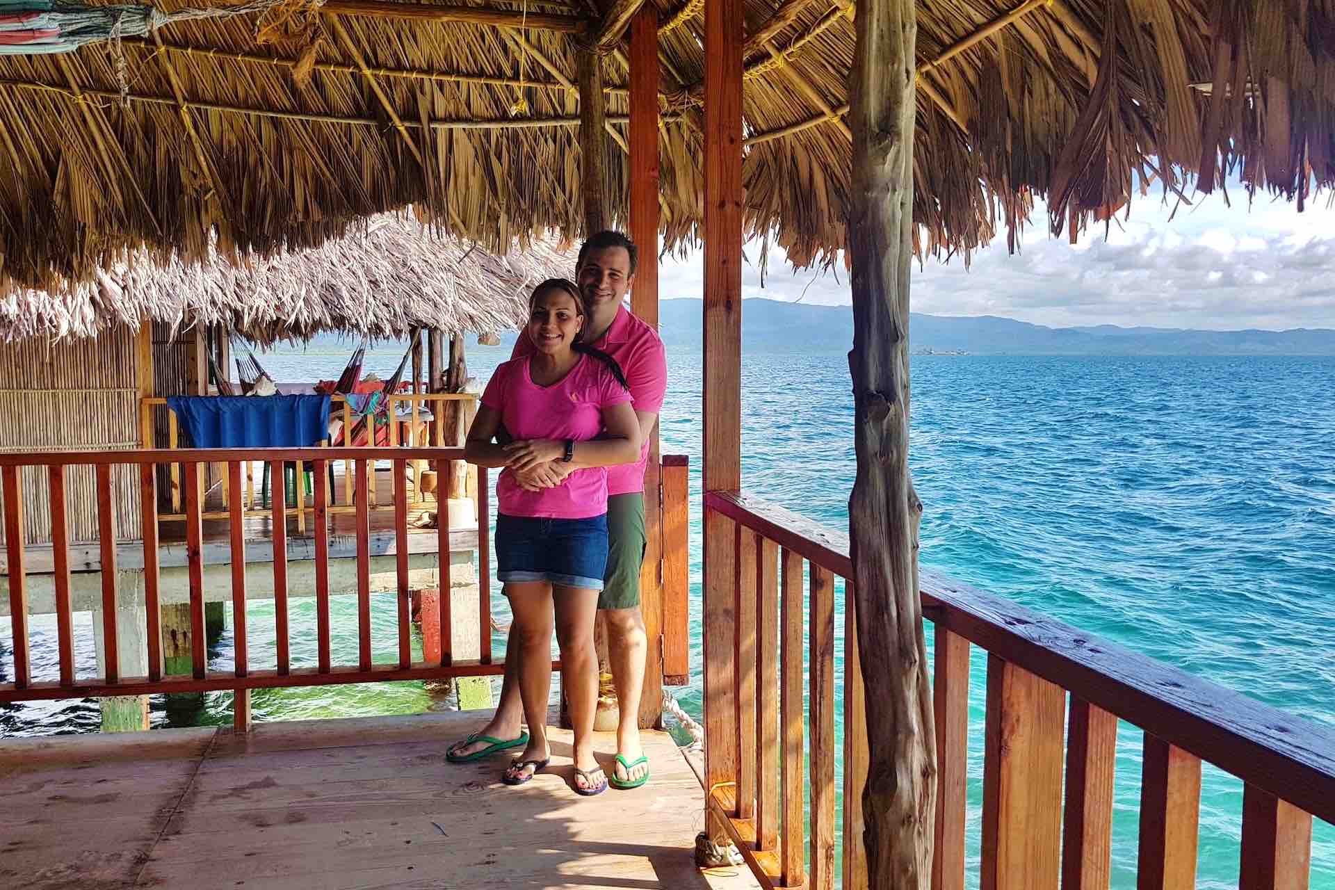 San Blas Narasgandup island Over Water Cabin couple on oceanview patio