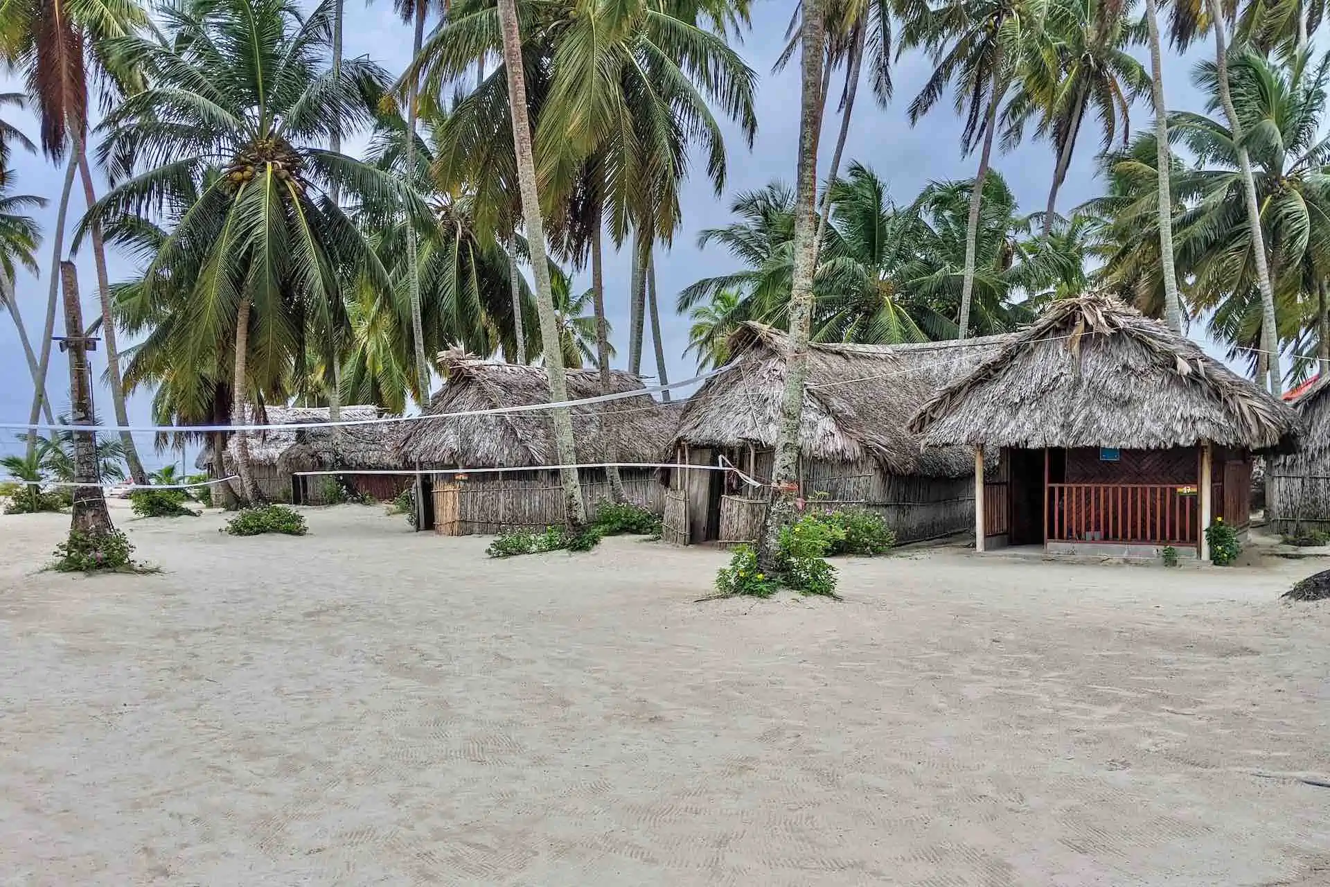 Tuba Senika San Blas view of beach cabins with volleyball net
