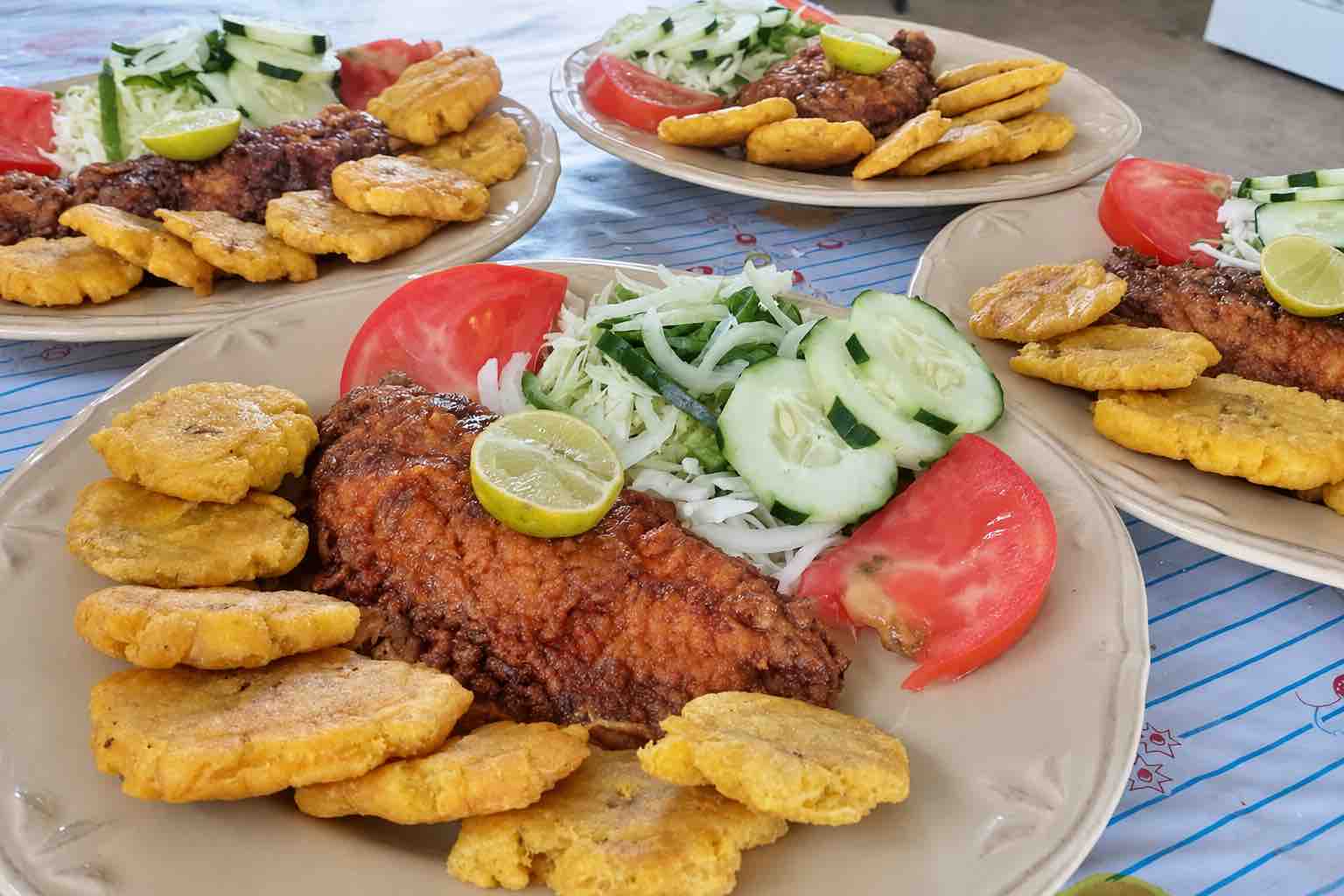 Fried Fish and Patacones Lunch on Isla Narasgandup Plates of fried fish, patacones and salad served for lunch on Isla Narasgandup
