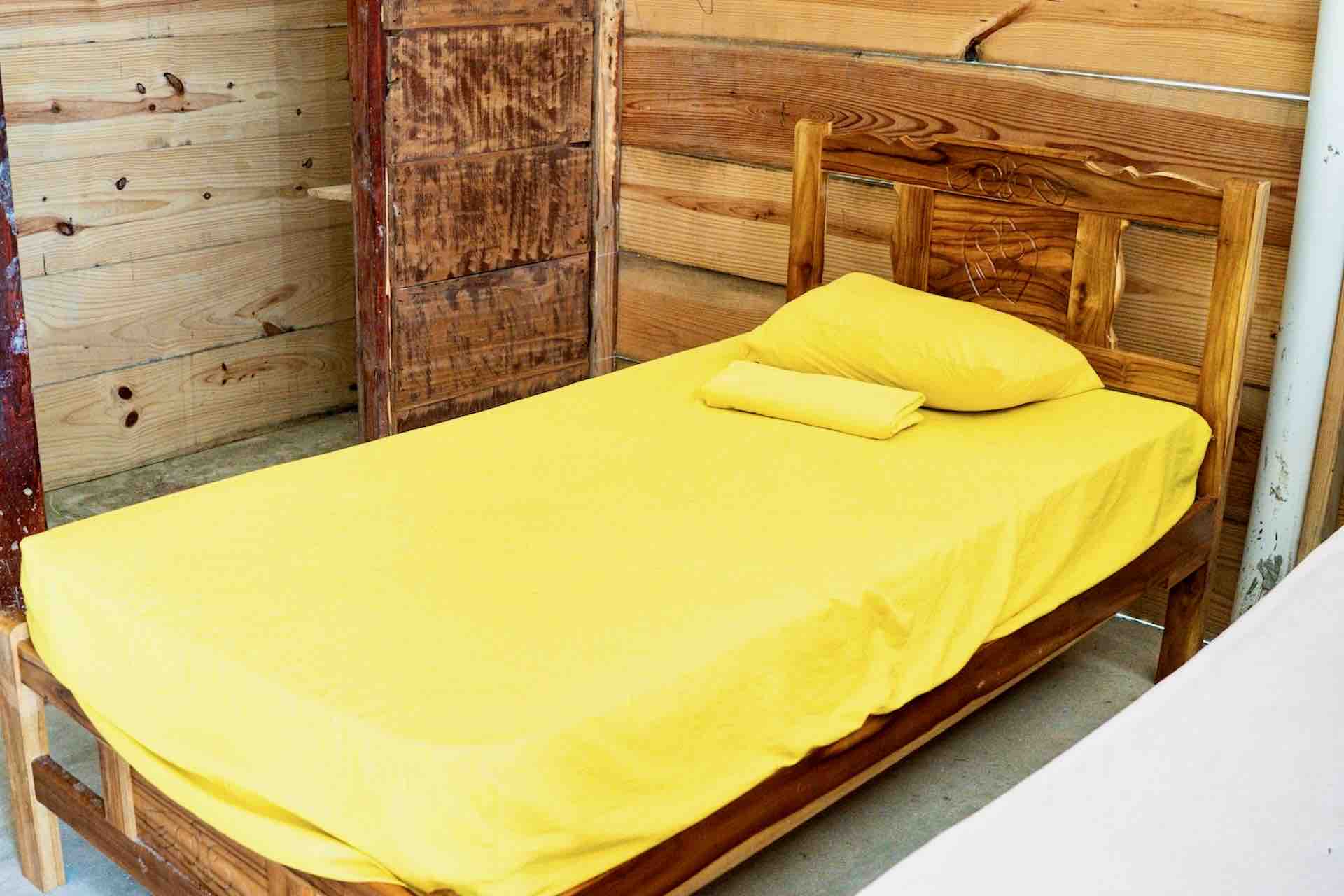 Private cabin with bed at Isla Asserya in the San Blas Islands, Panama