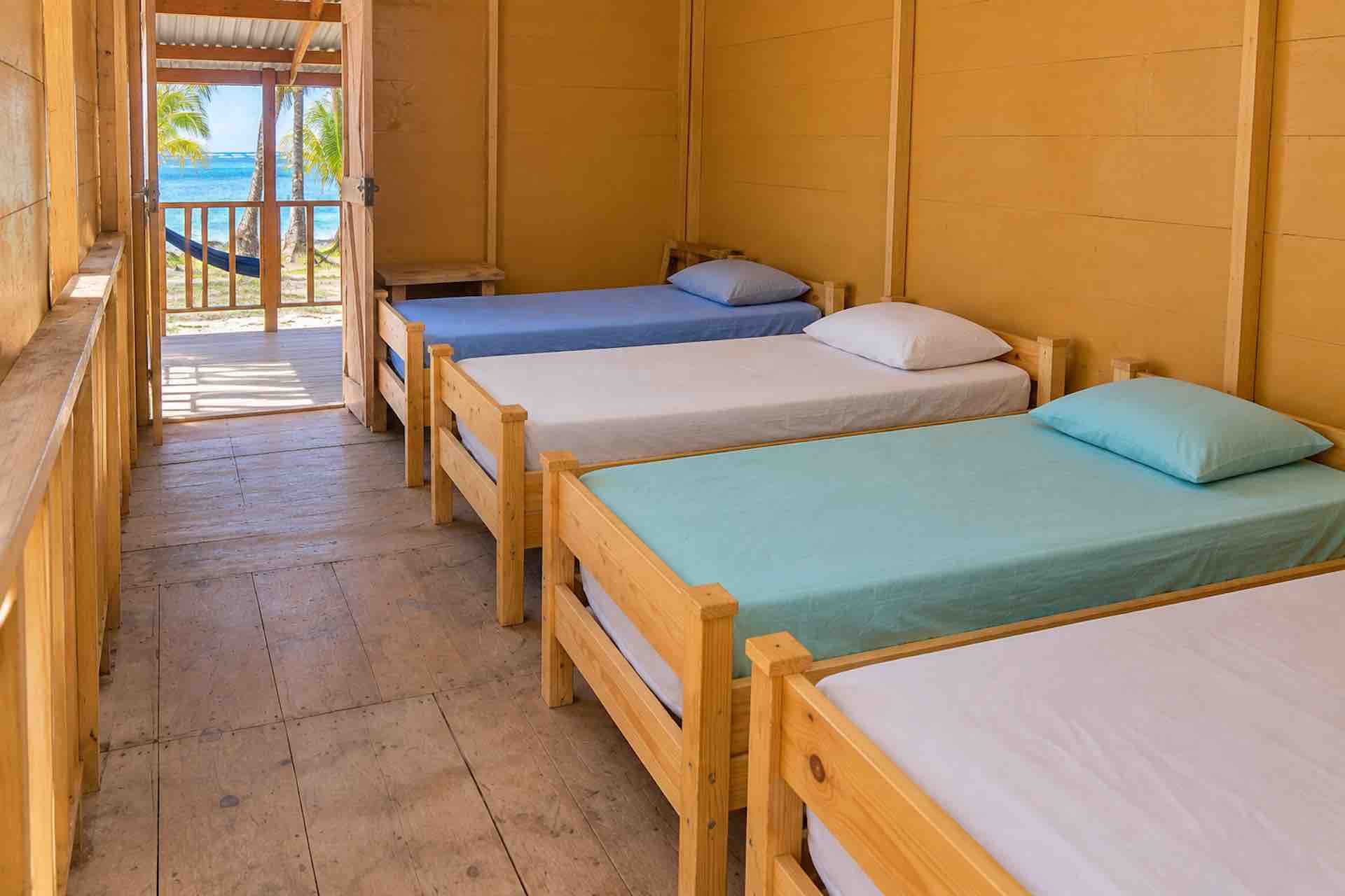 Shared sleeping area with separate beds on Yani Island in San Blas