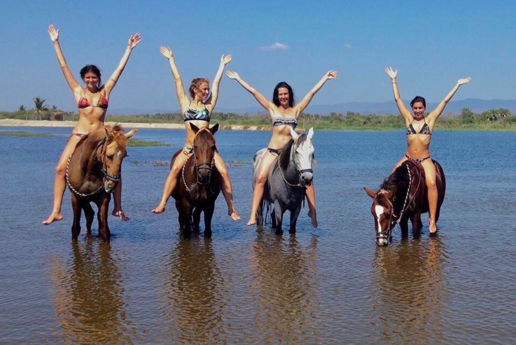 Huatulco Tours La VEntanilla beach horseback riding tour guests sitting on horses