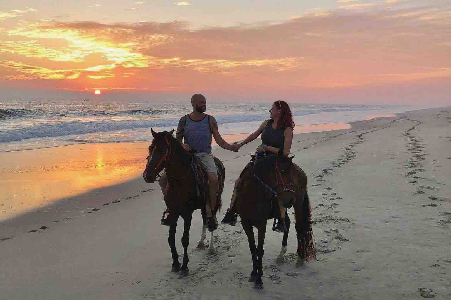 Mexico Beach Horseback couple during sunset holding hands