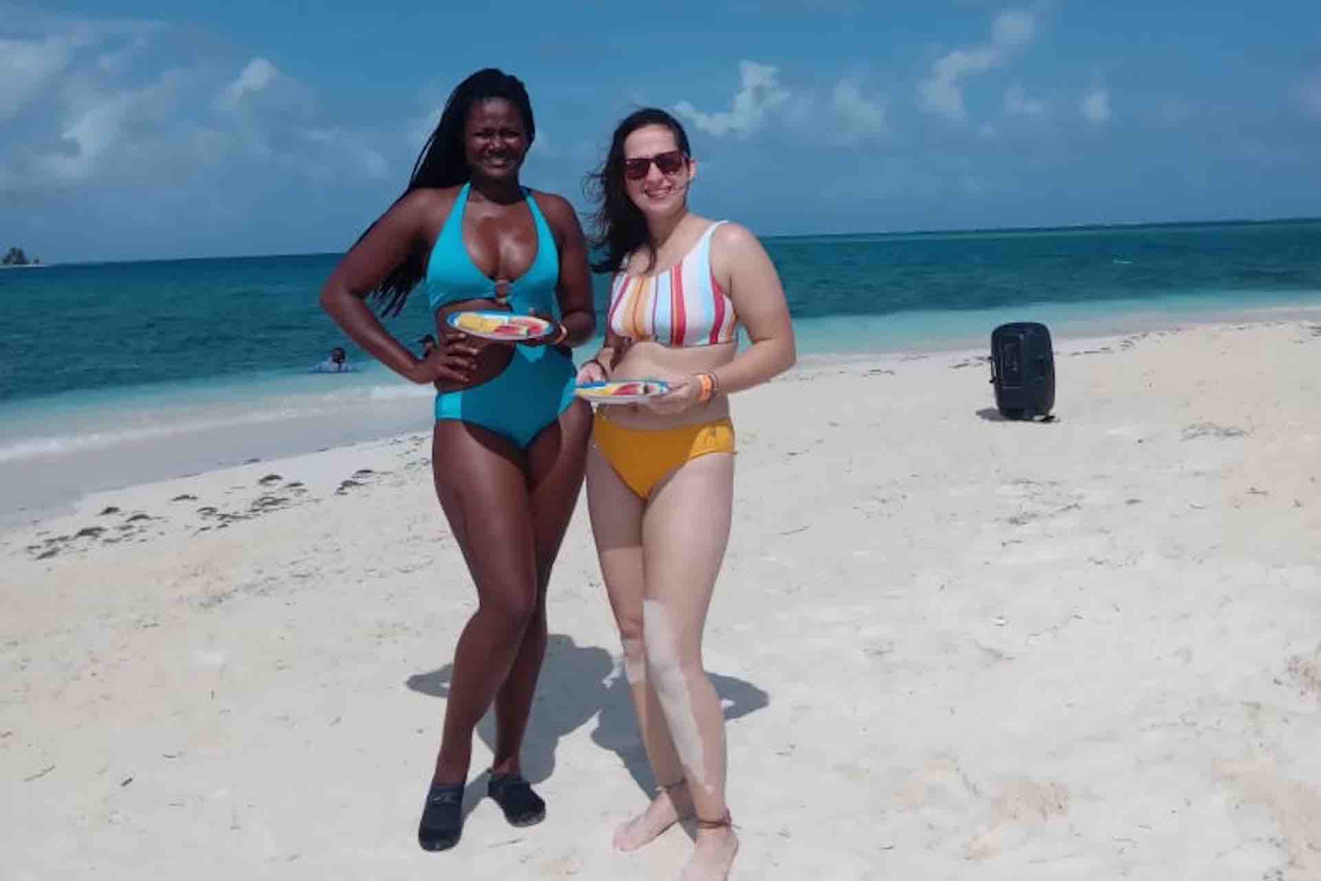 Isla Perro San Blas beach day women standing on white beach with fruit snacks