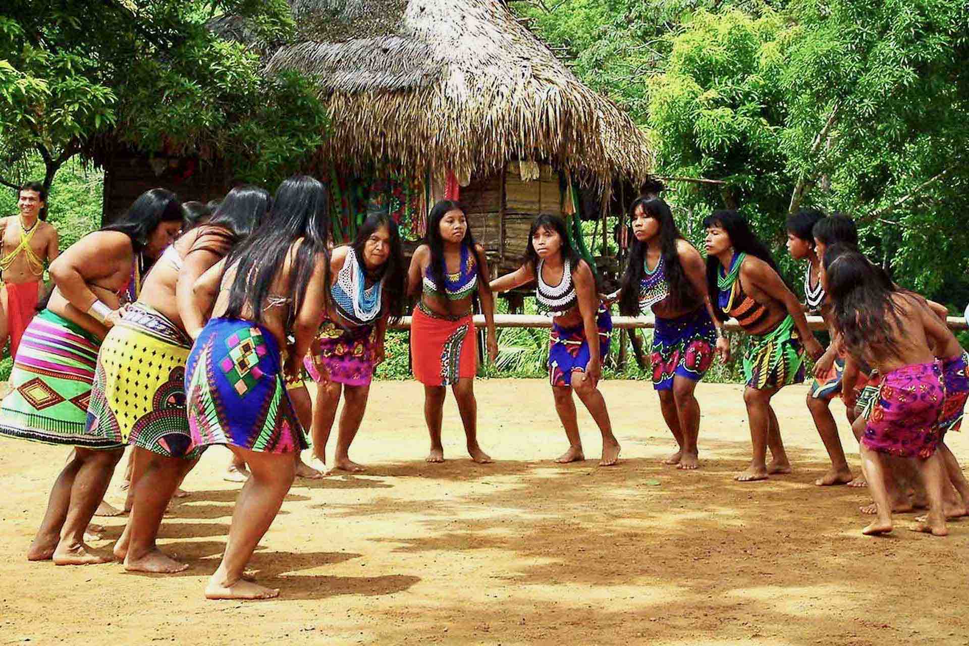 Embera Panama Tribe Indian Village tour man playing flute women dancing