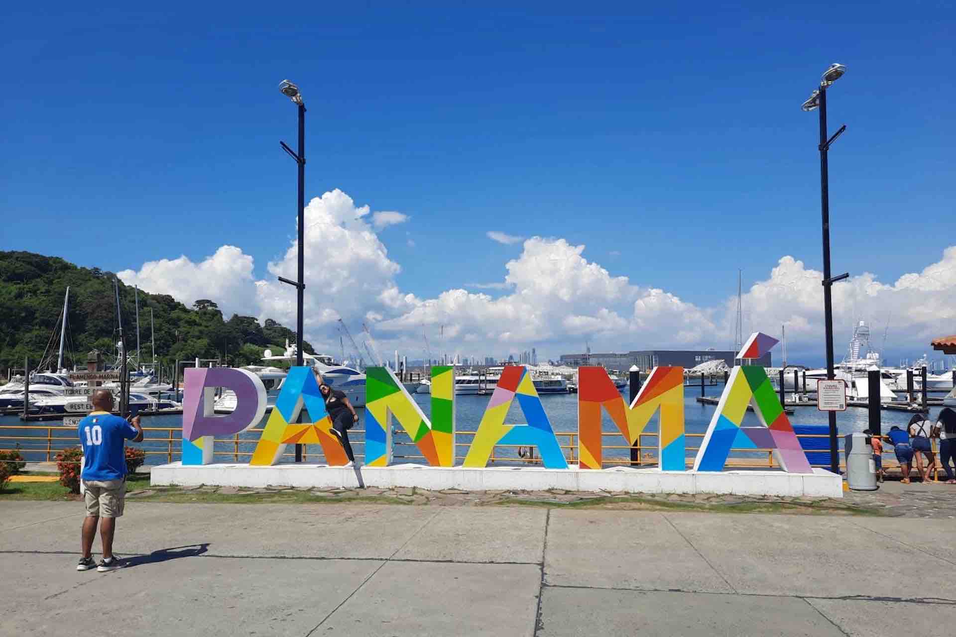 Panama City Panama Canal tour guests at Panama sign