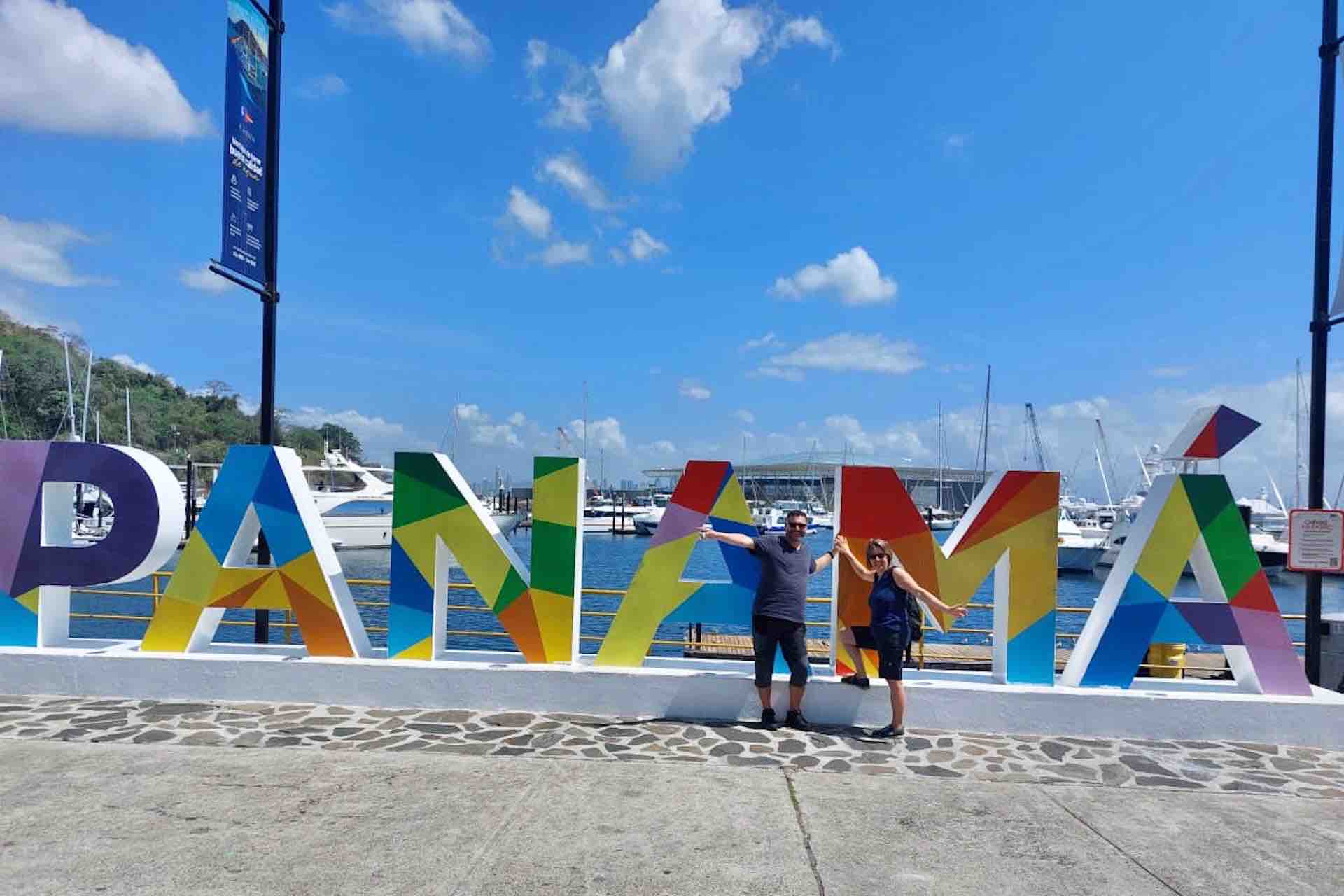 Panama City Panama Canal tour guests in front of Panama sign Avenida Balboa