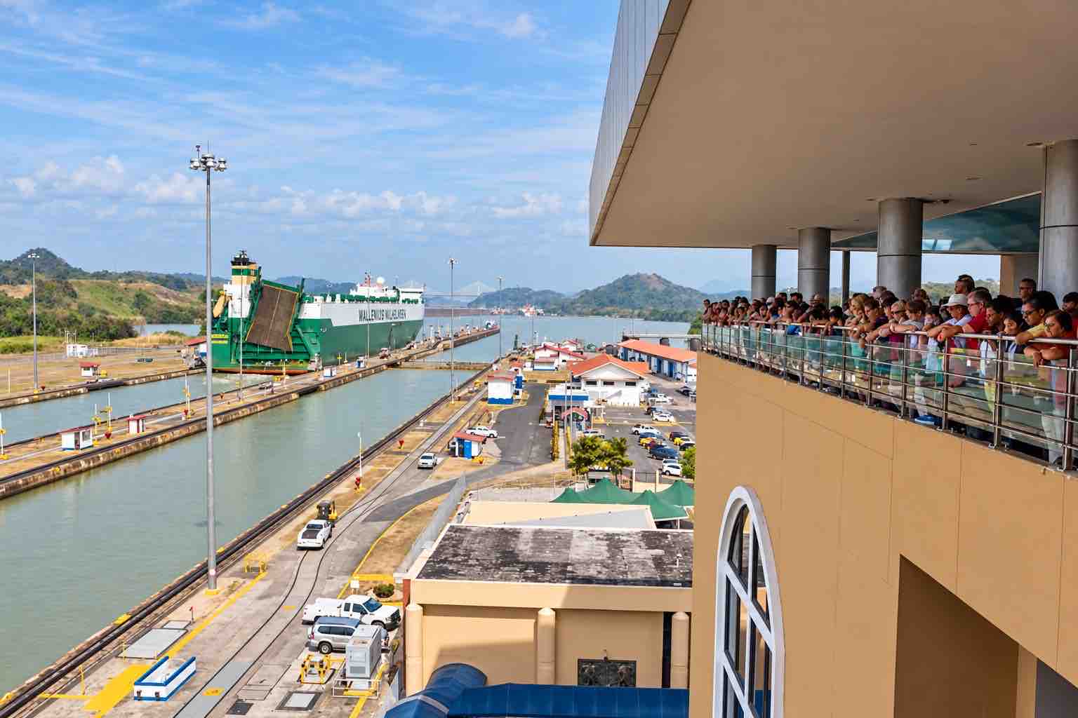 Panama Canal and City Tour: visitors watching ships from a Panama Canal viewing balcony.