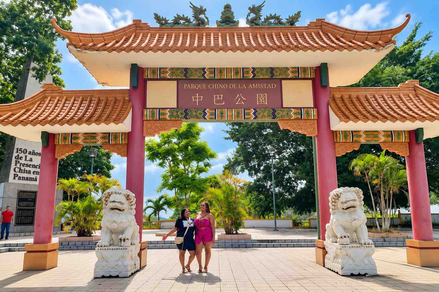 Panama Canal and City Tour: two visitors standing beneath a traditional Chinese gateway.