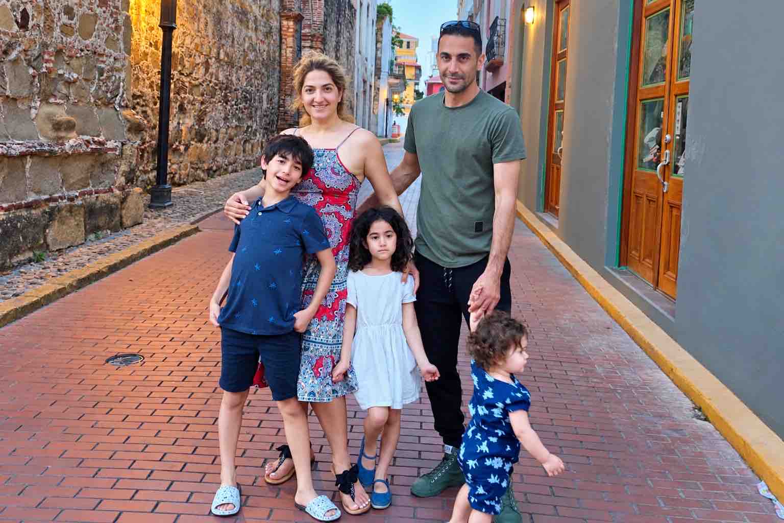 Panama Canal and City Tour: a family with three children on a brick-paved street in Casco Viejo.