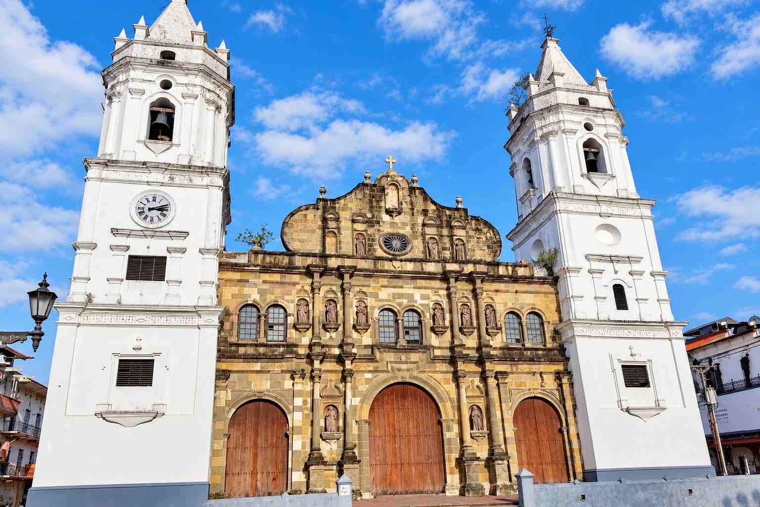 Panama Canal and City Tour: twin white towers and stone facade of the Metropolitan Cathedral in Casco Antiguo.