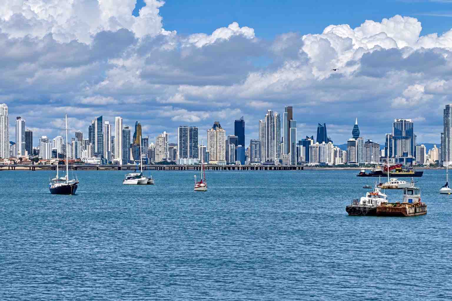 Panama Canal and City Tour: boats on the bay with the Panama City skyline in the background.