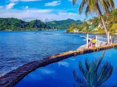 Isla Grande Panama hotel pool with palm trees