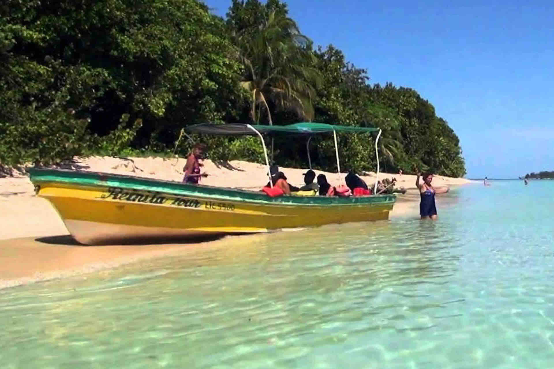 bocas del toro zapatilla island hopping tour beach with lancha boat and guests