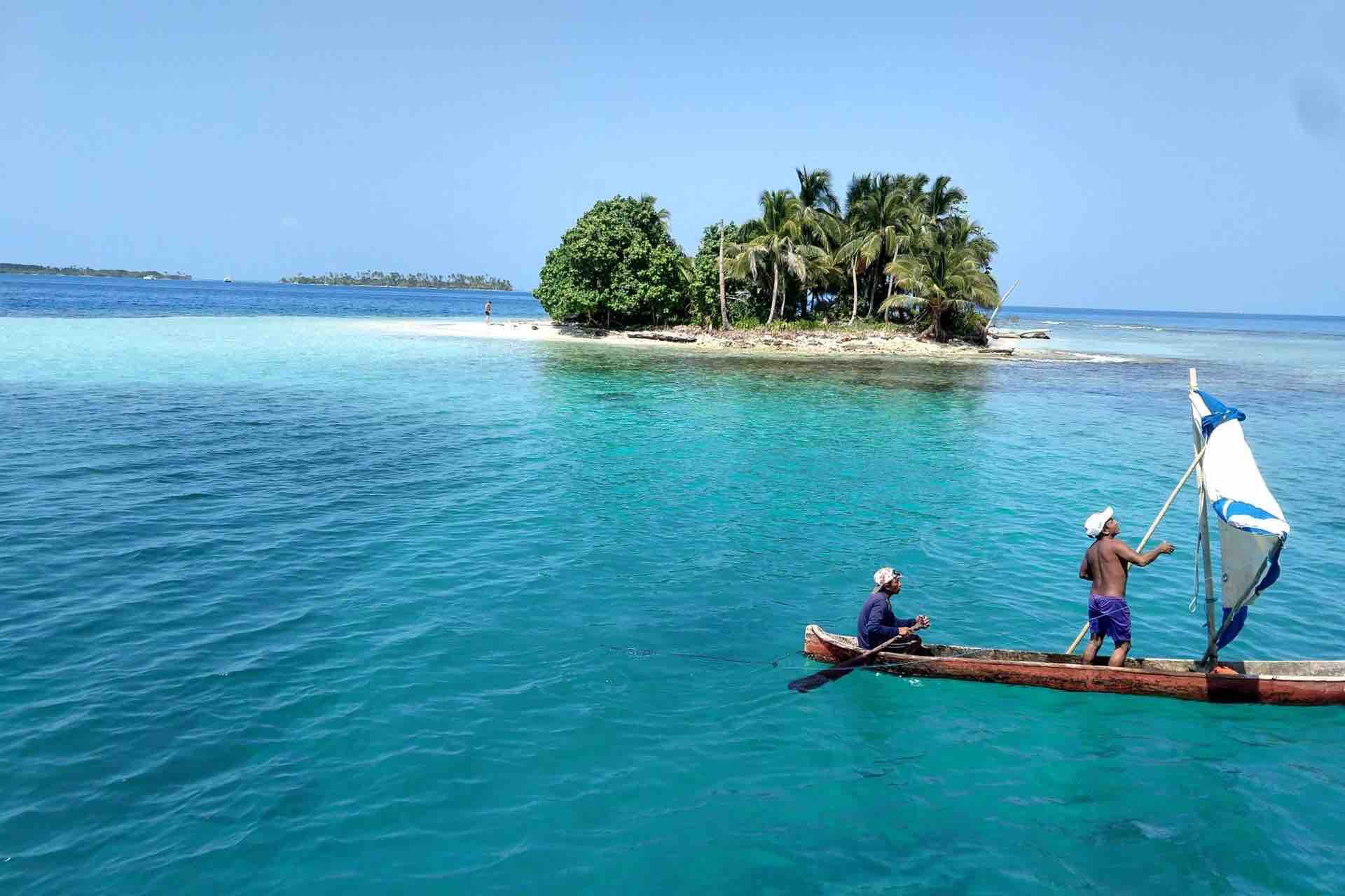 San Blas island with traditional Kuna ulu canoe