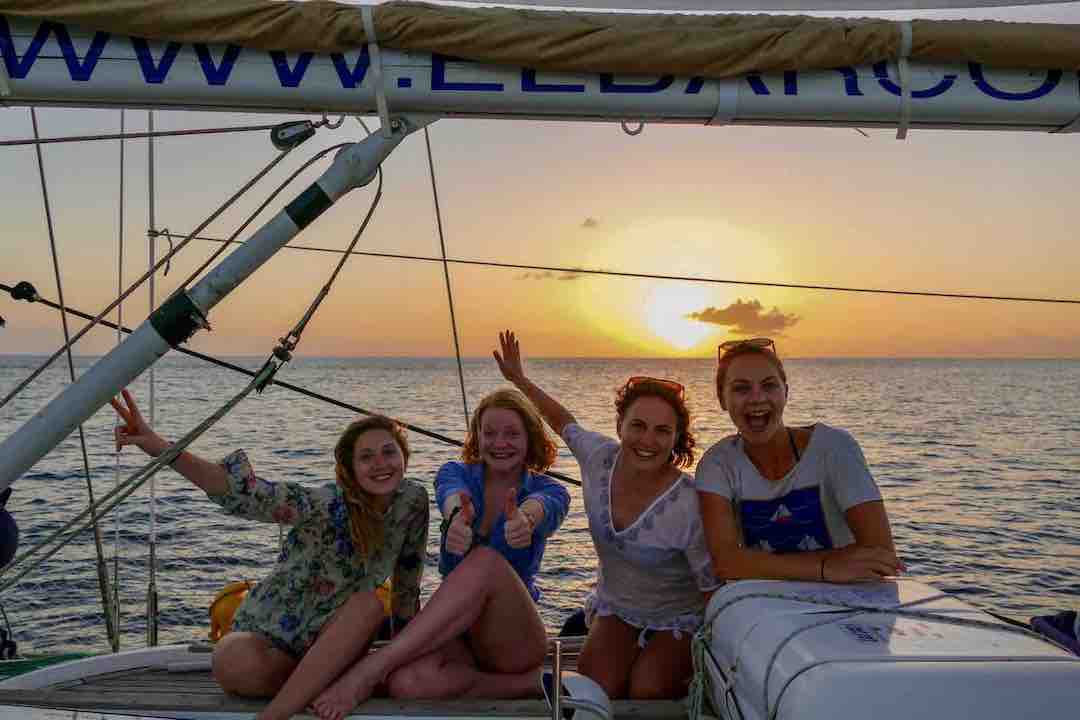 Maverick sailboat guests at sunset time