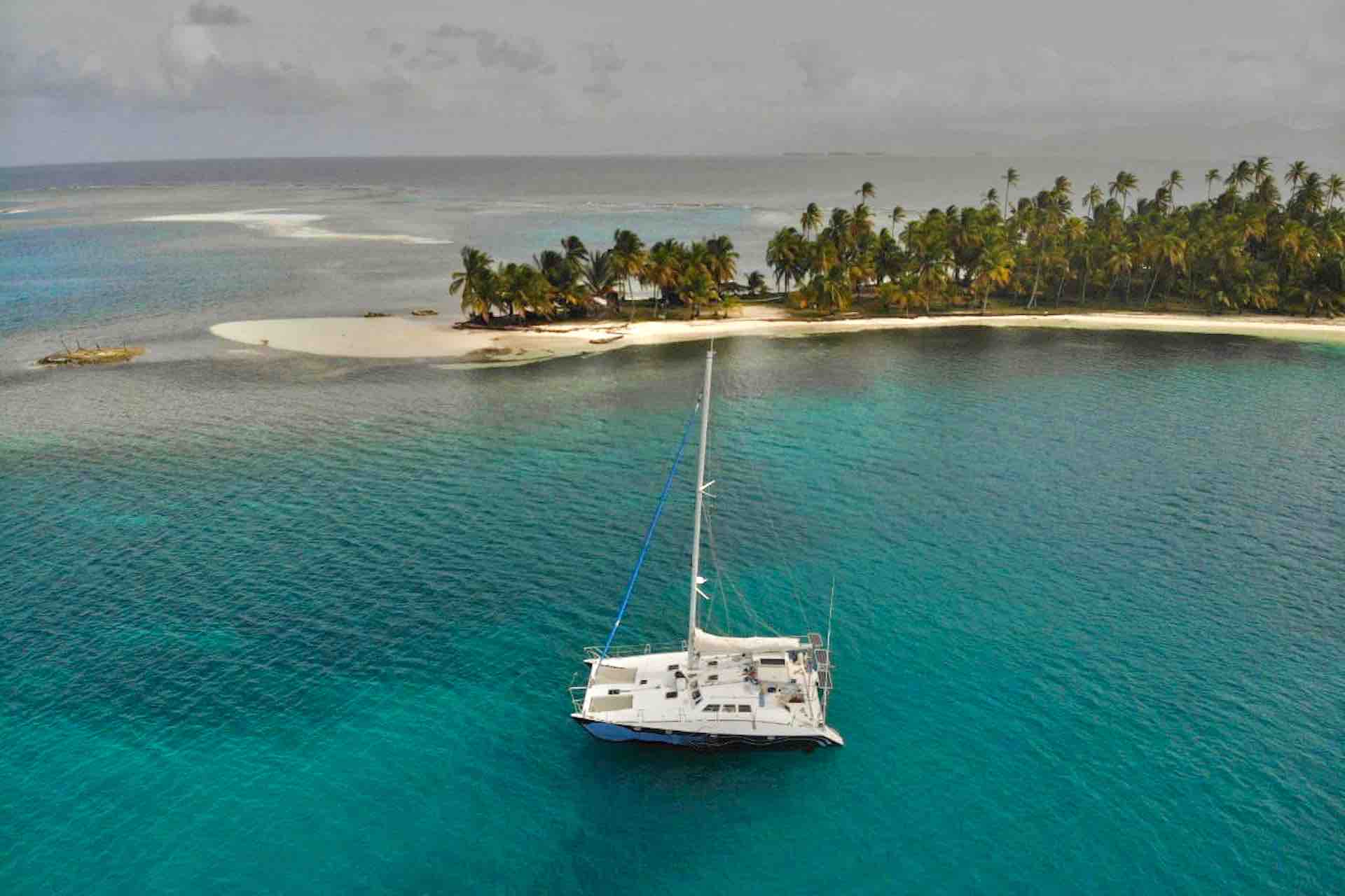 Drone view of Custom catamaran at anchor in San Blas island