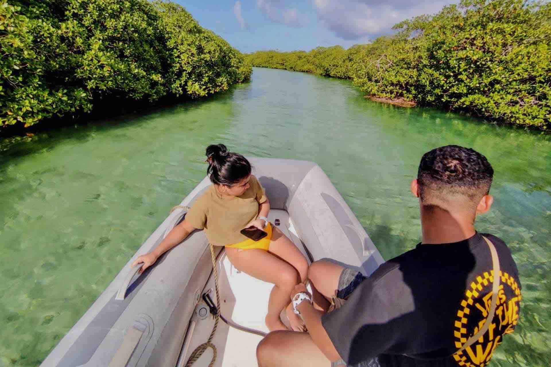 Isla Grande Panama Caribbean Coast island hopping tou guests in Tunnel of Love mangrove forest on lancha boat