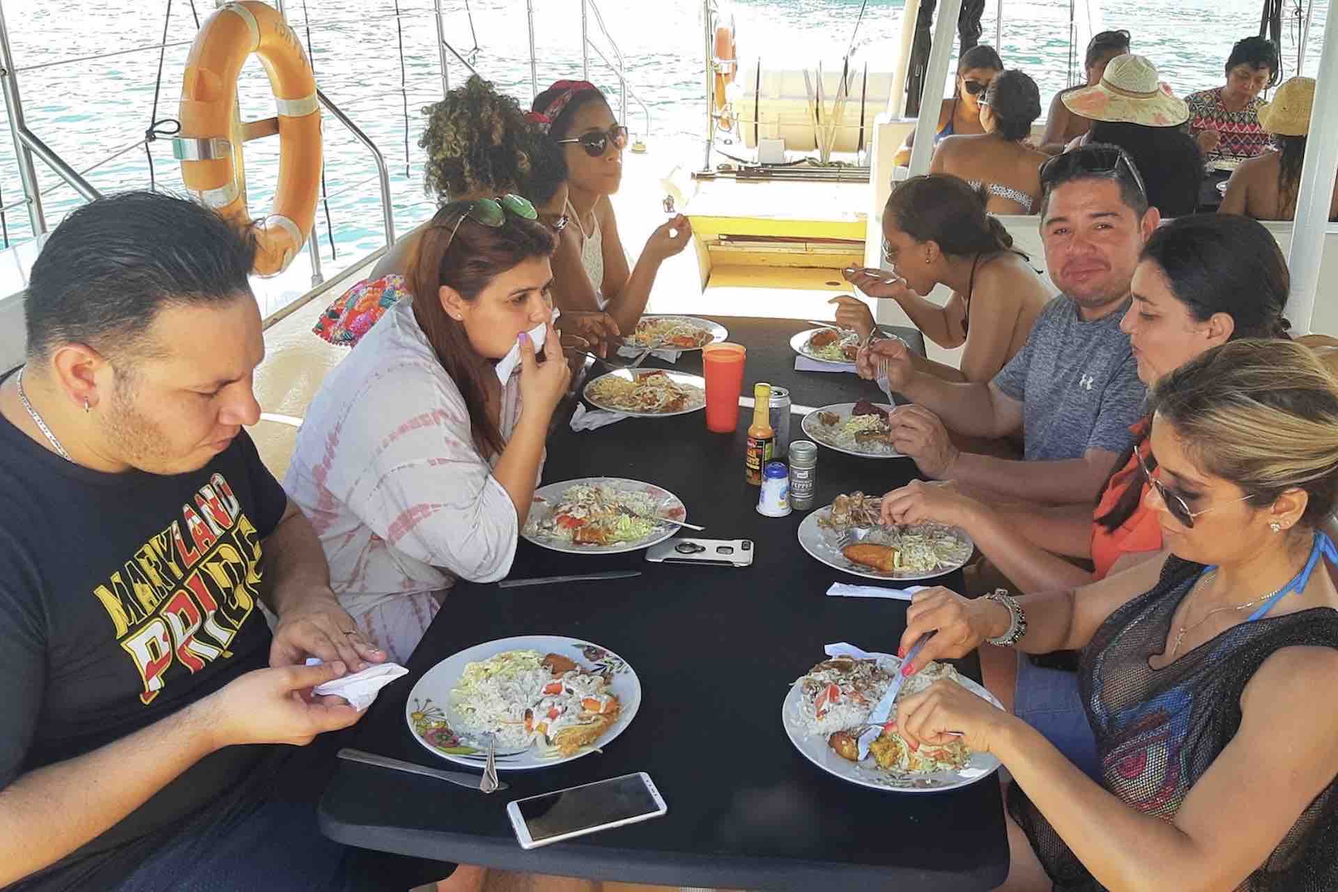 Manga Taboga island sailboat charter lunch guests eating