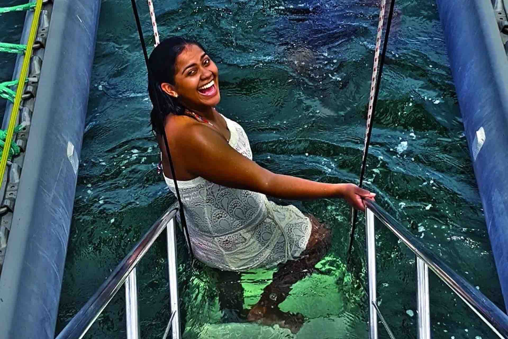 Manga Taboga island sailboat charter smiling woman stairs
