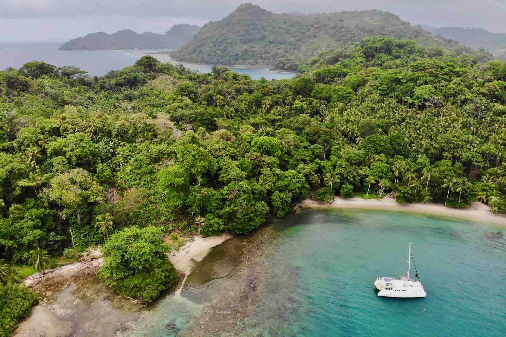 Taboga island Panama private sailboat tour catamaran anchored in bay playa blanca