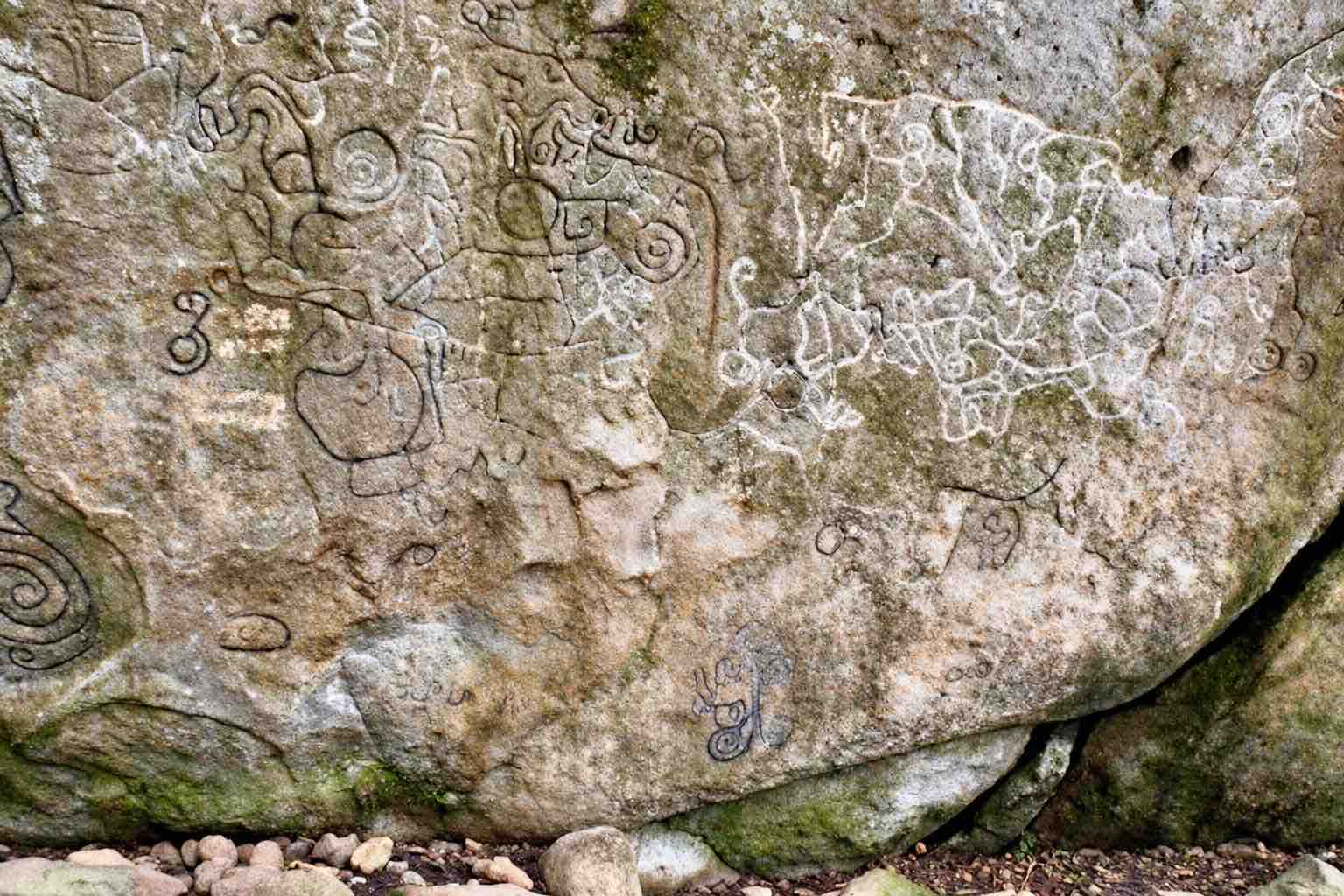 Carved symbols and spirals on the Piedra Pintada rock