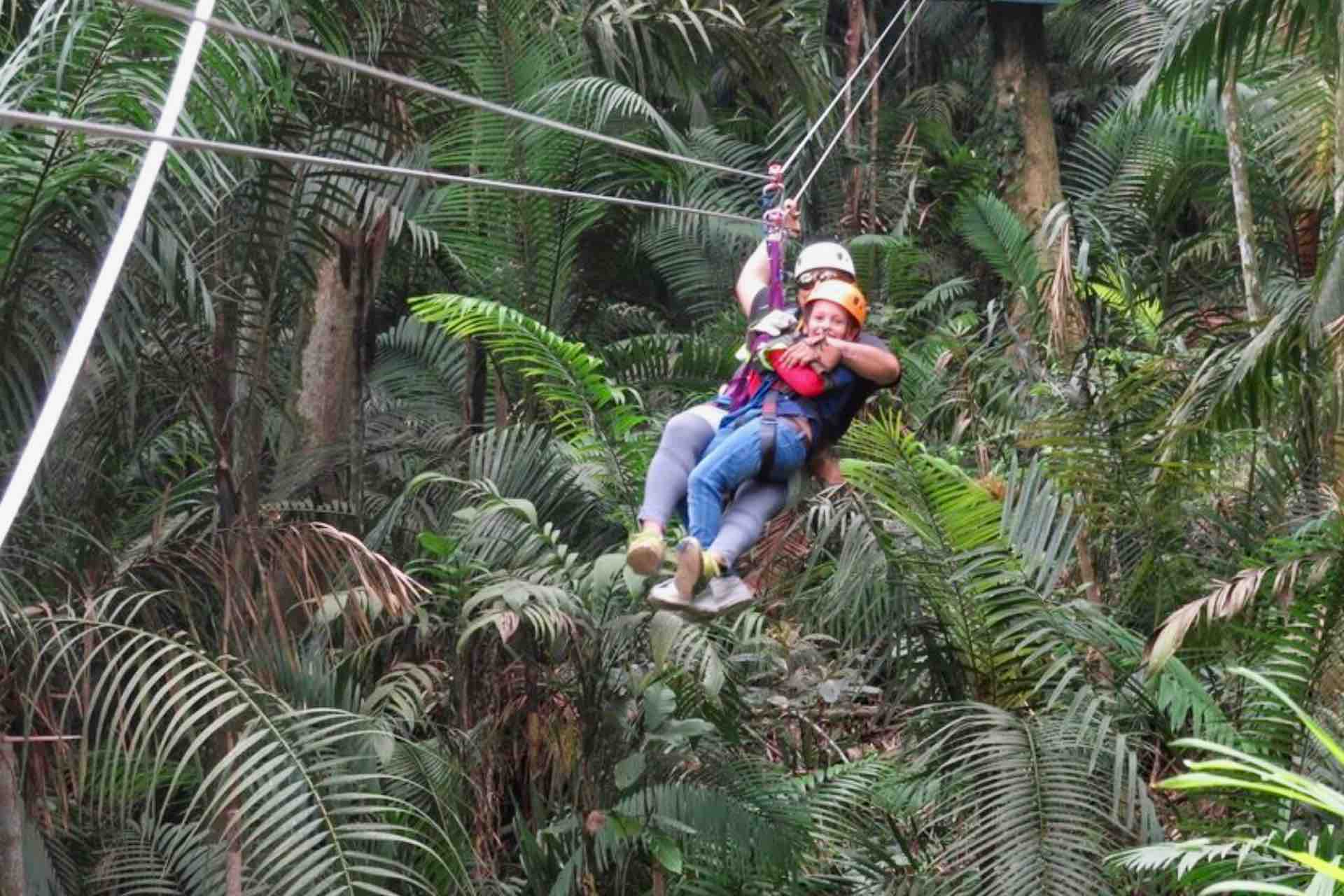 Panama Canal Zipline instructor with child 3