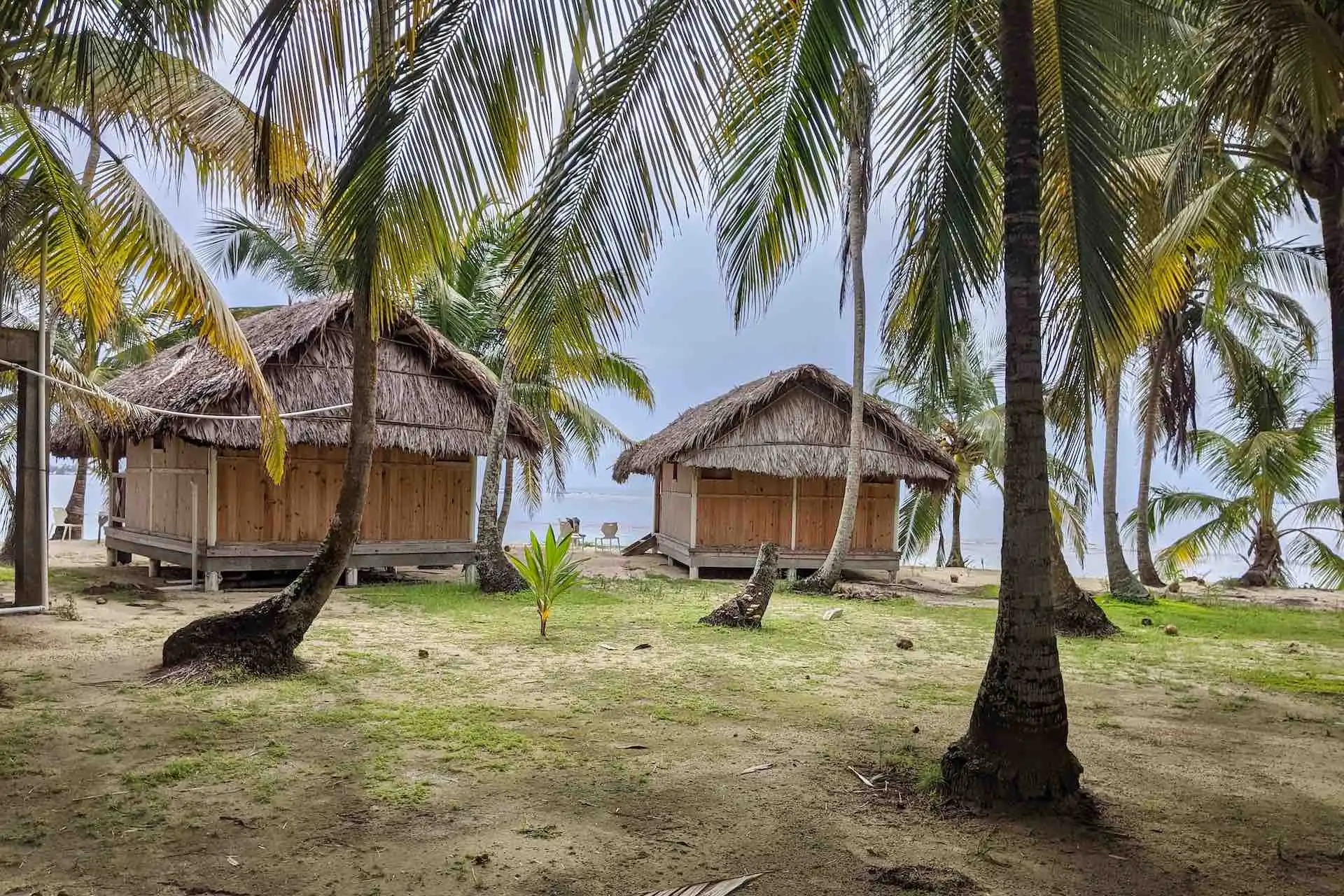 San Blas Isla Perro island oceanfront cabins palm trees