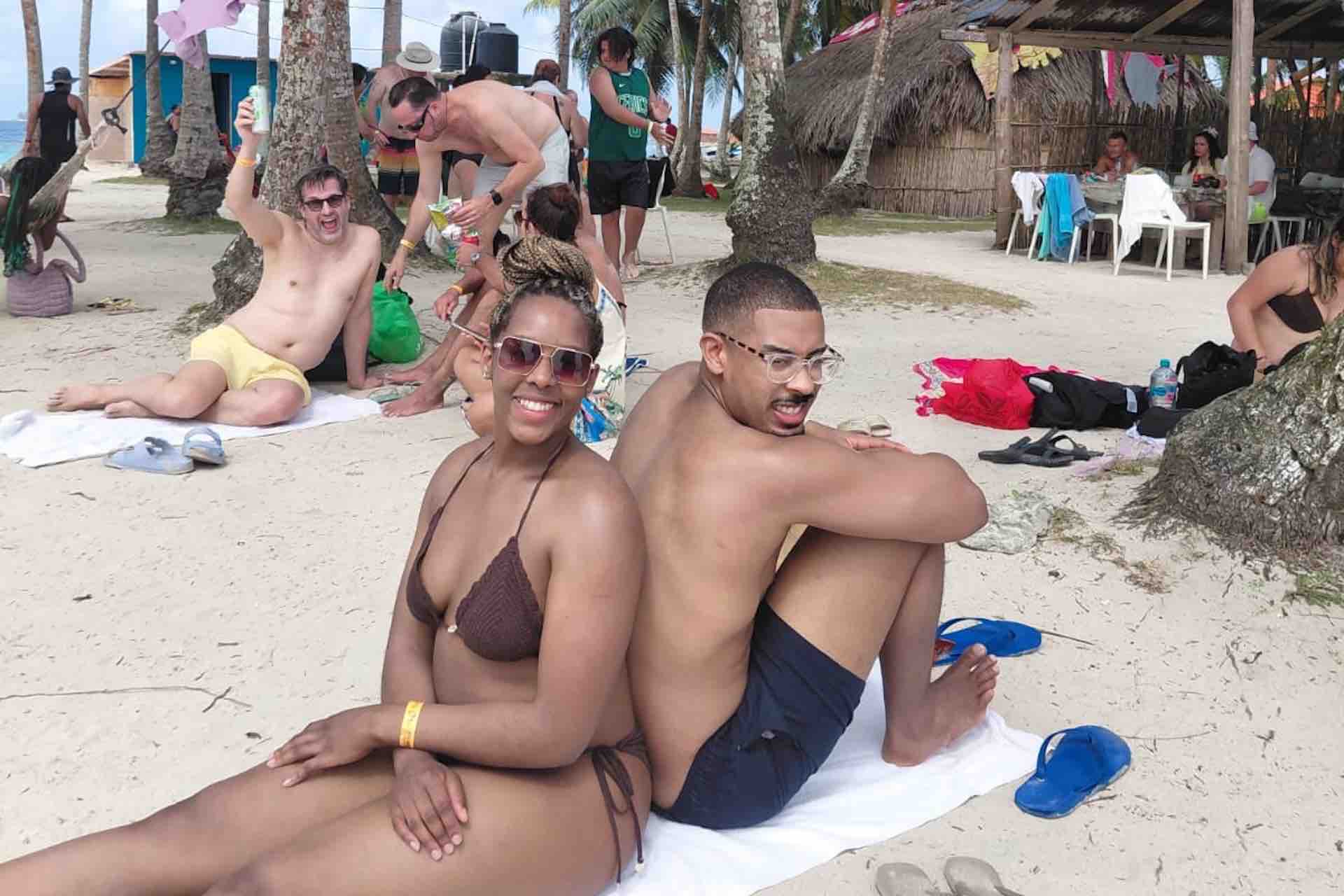 Guests relaxing on the beach at Isla Perro San Blas