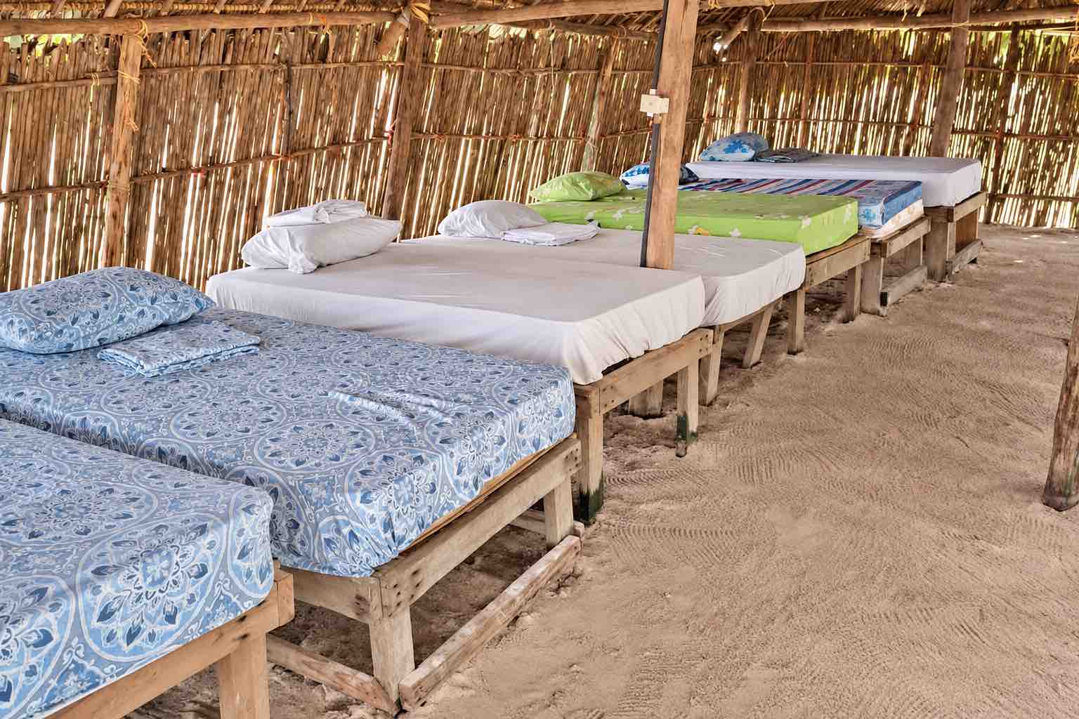 Isla Aroma Shared Cabin Beds Beds inside a rustic shared cabin on Isla Aroma, San Blas