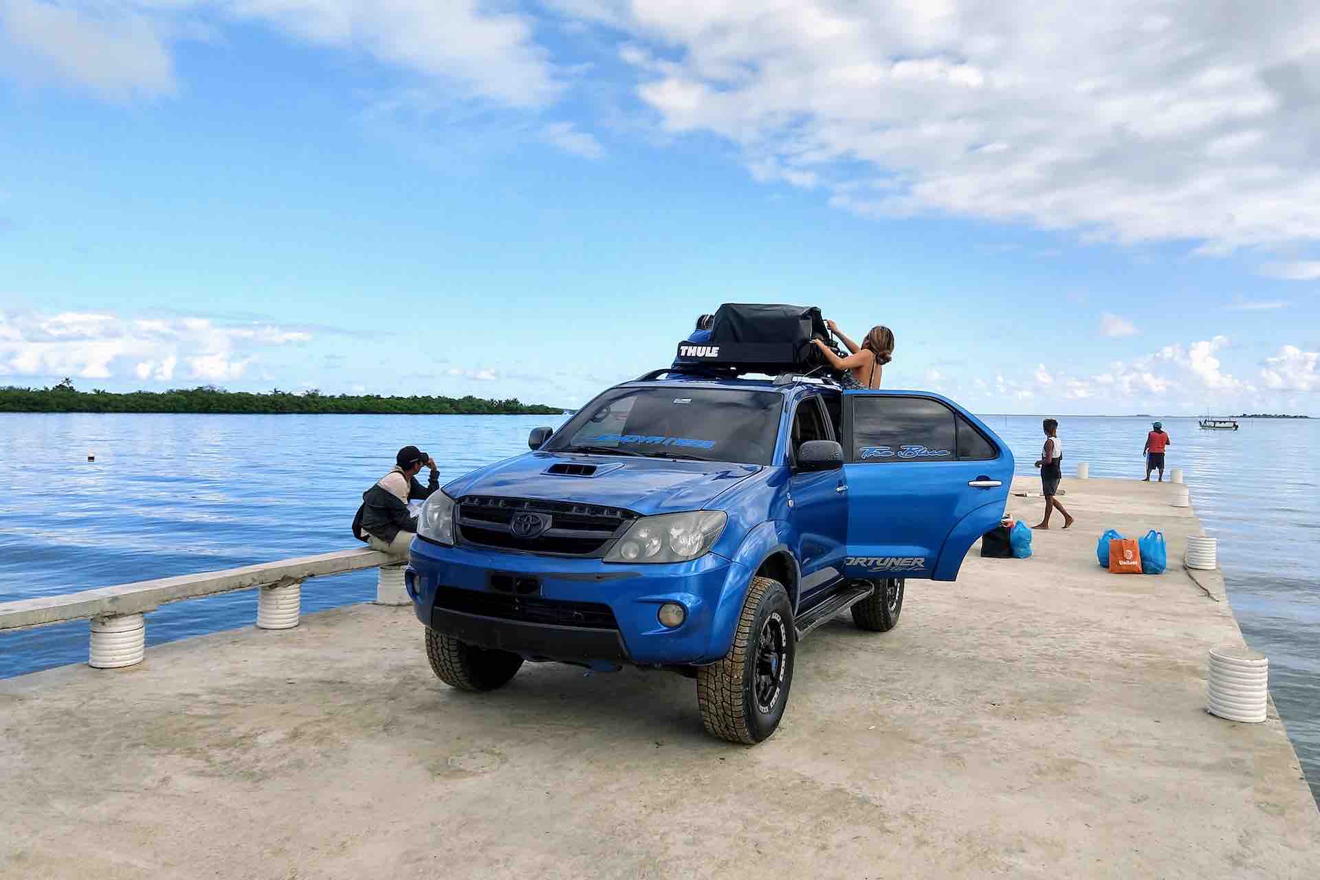 San Blas 4×4 Transfer to the Port of Cartí Blue 4×4 SUV parked at the waterfront before a San Blas boat transfer