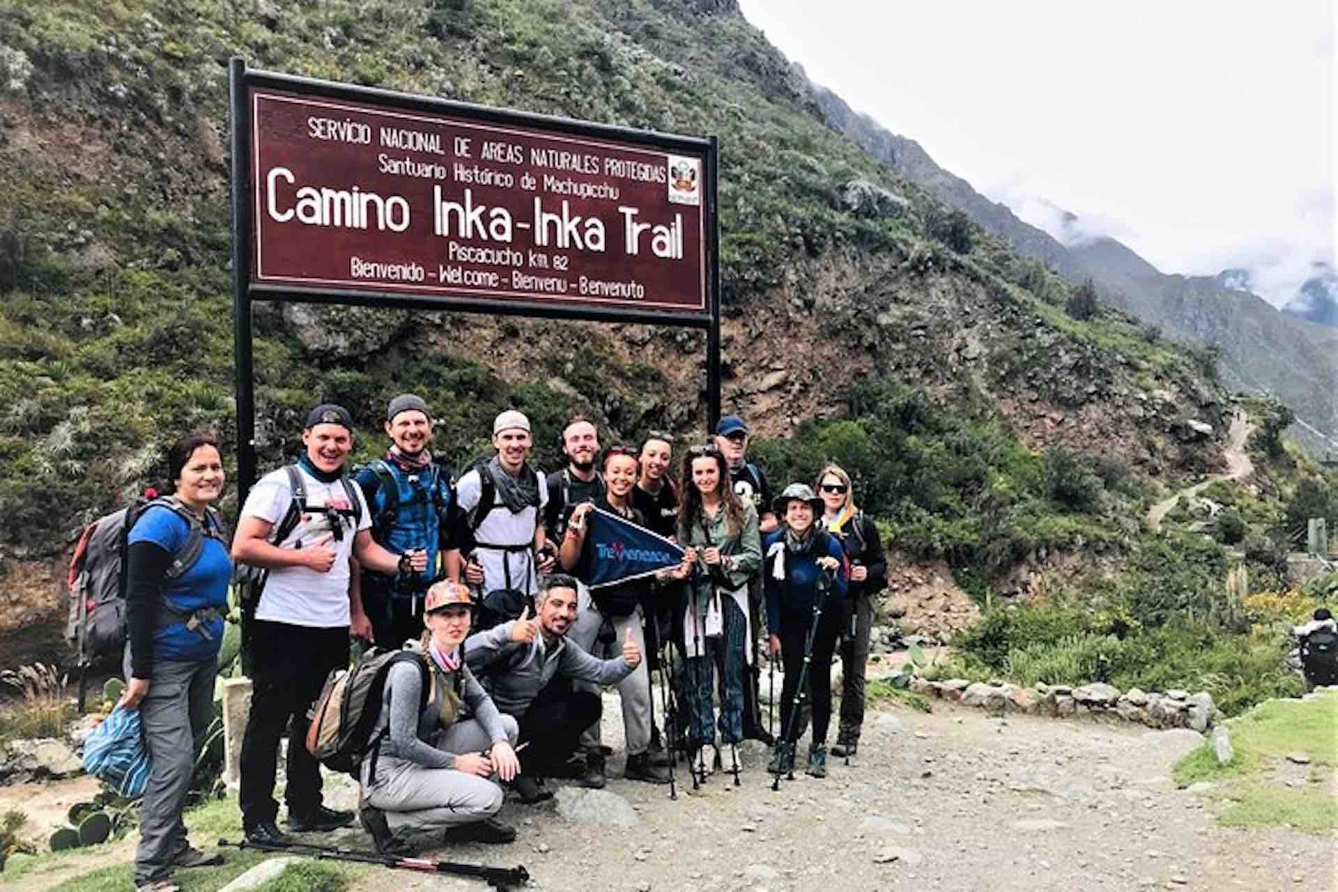 Machu Picchu group photo of Inca trail sign