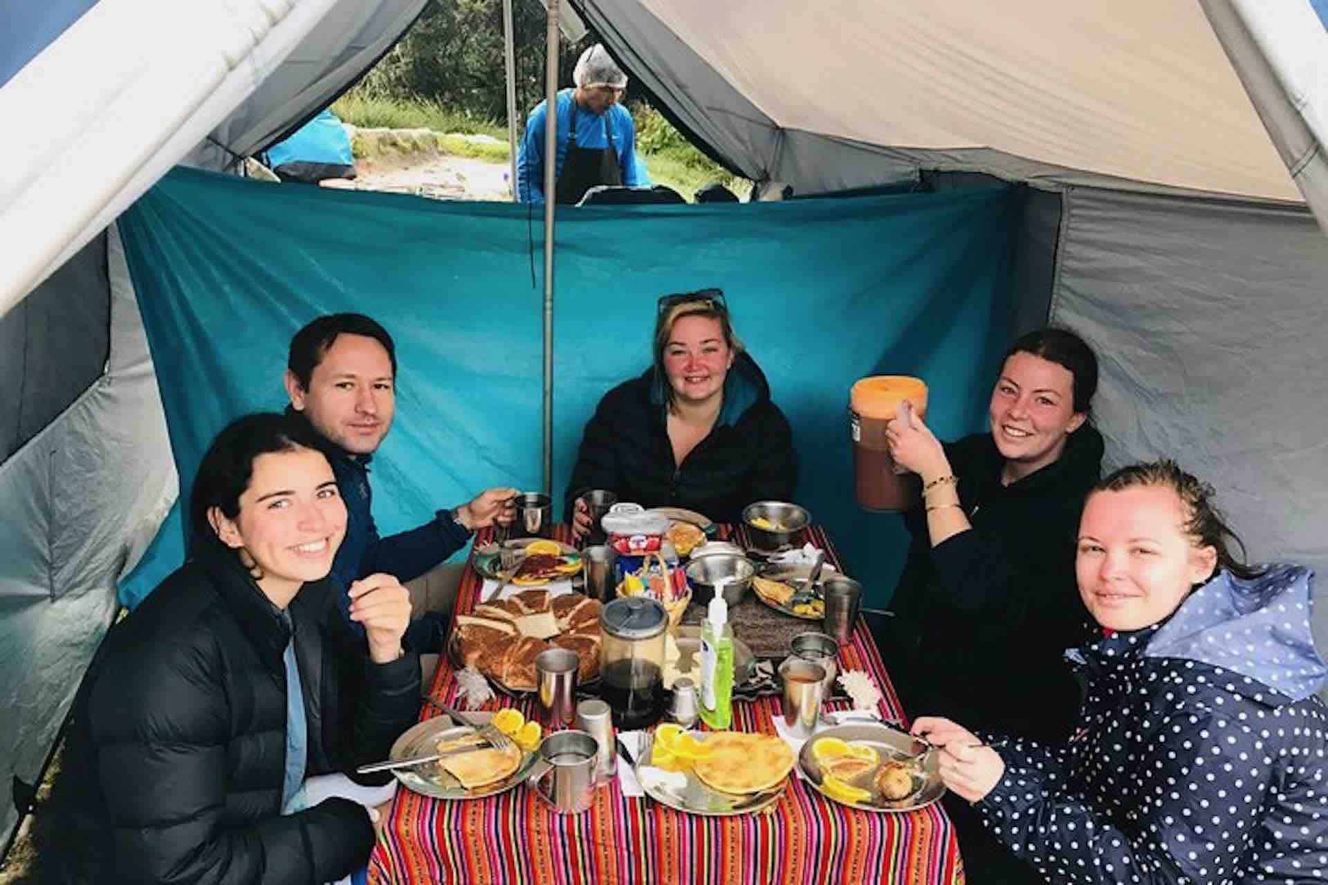 Machu Picchu inca trail guests in tent with table