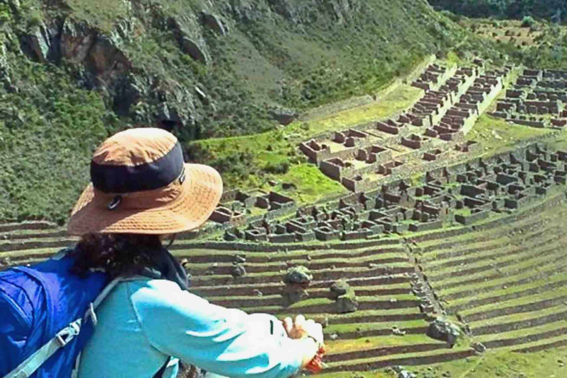 Woman on Machu Picchu looking at valley