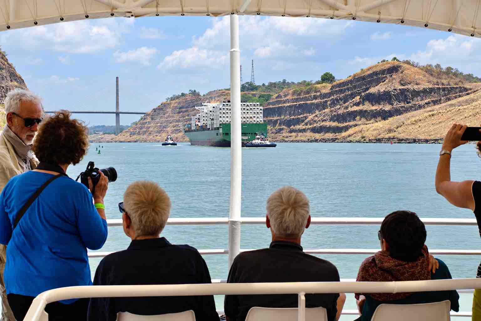 Panama Canal Partial Transit Tour – Culebra Cut Passenger View Panama Canal partial transit tour: passengers viewing the rocky banks of Culebra Cut from the Pacific Queen.