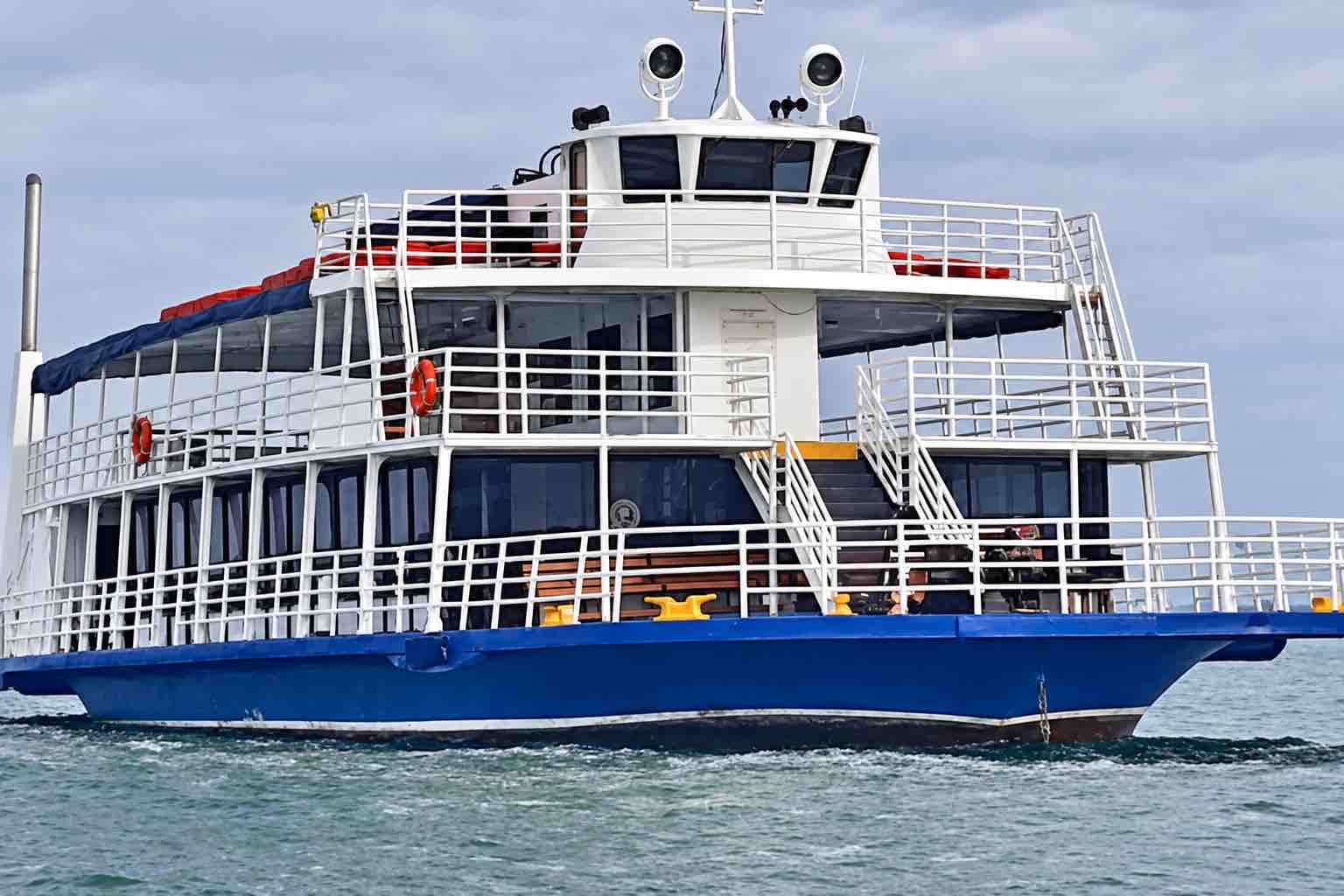 Panama Canal partial transit tour: exterior view of the Tuira II passenger boat on the water.