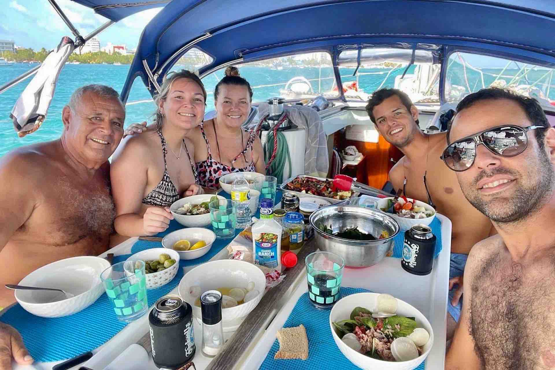 San Blas sailing charter captain with guests having lunch