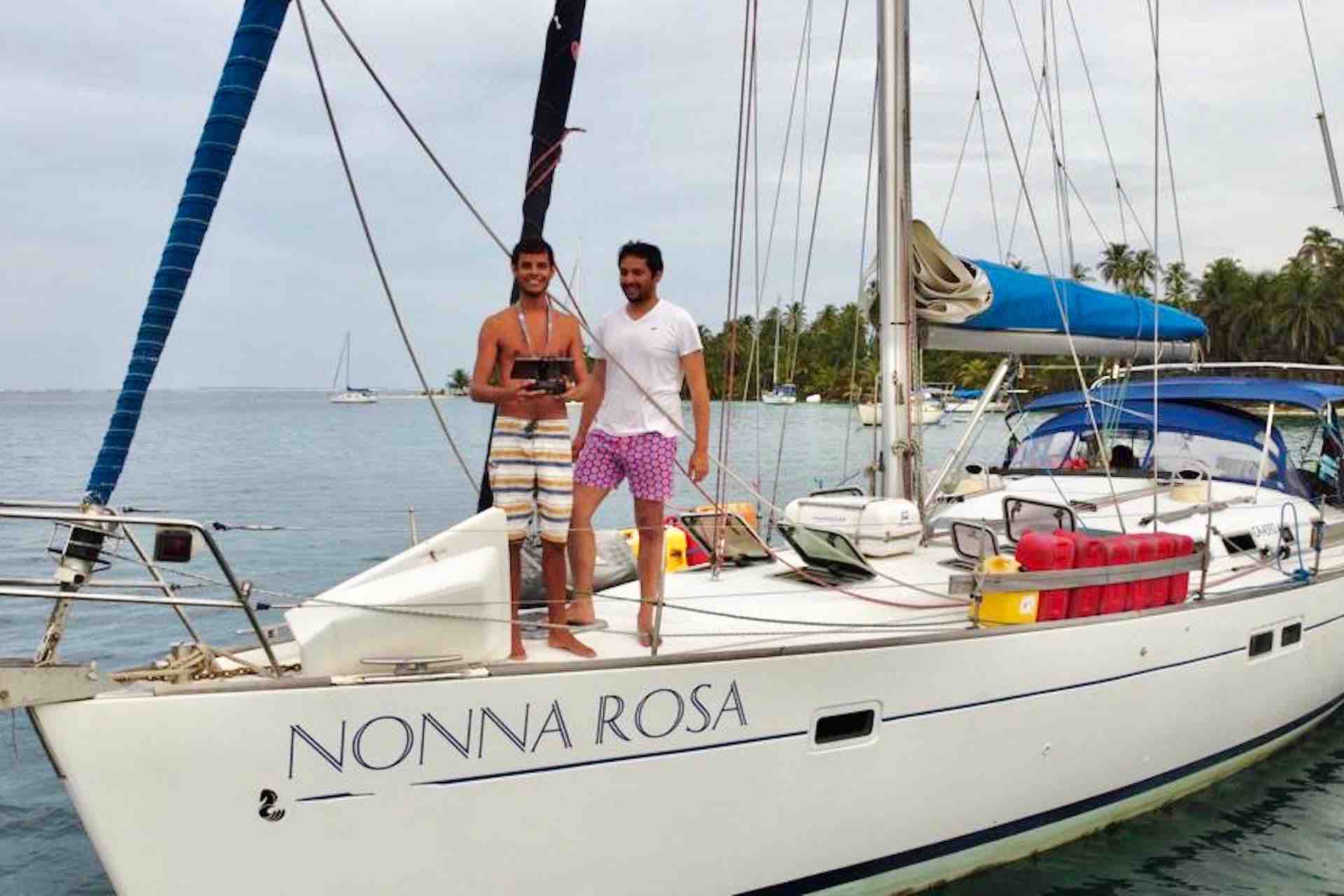 San Blas sailing charter sailboat captain standing on deck with drone remote