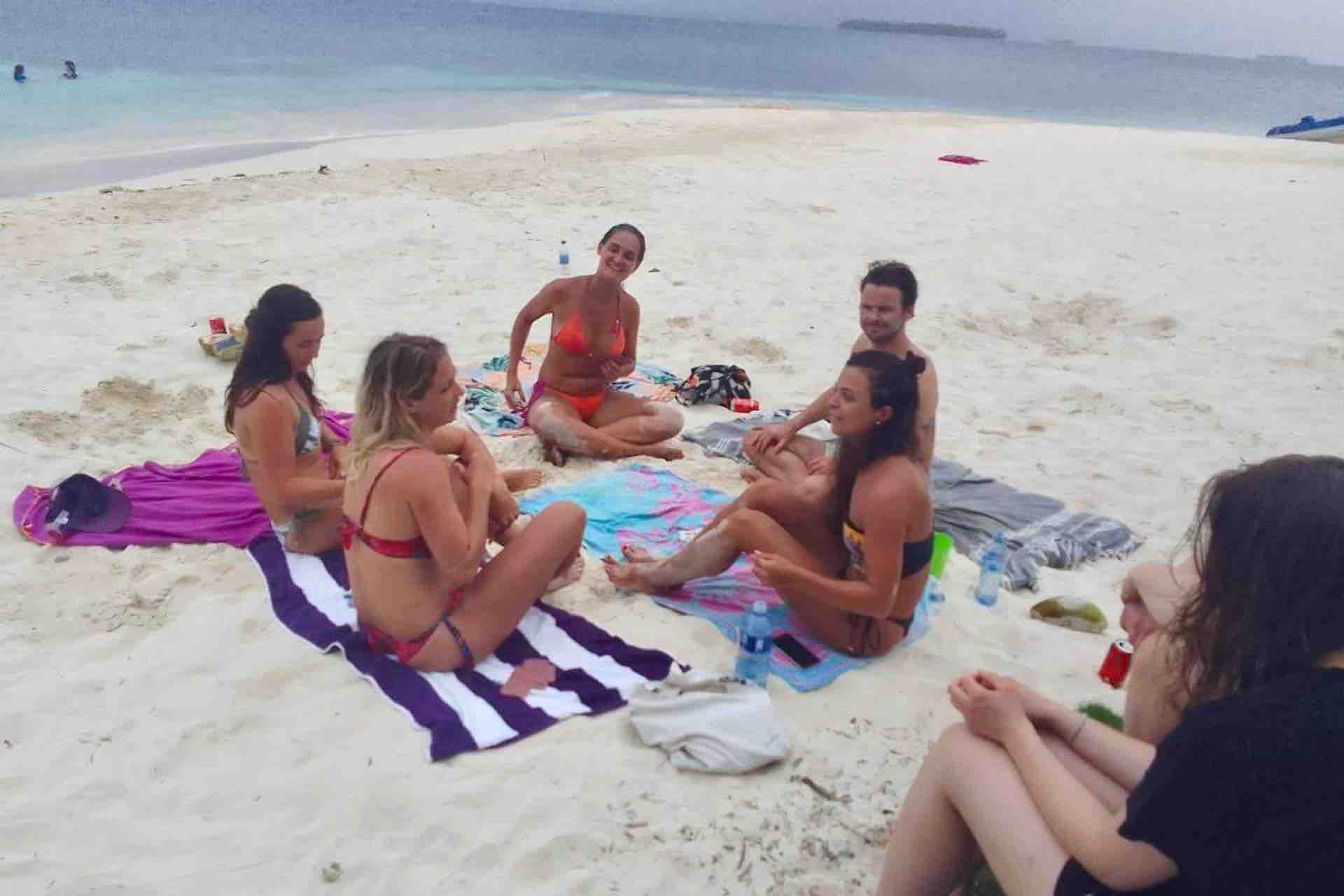 Isla Pelicano San Blas guests on beach